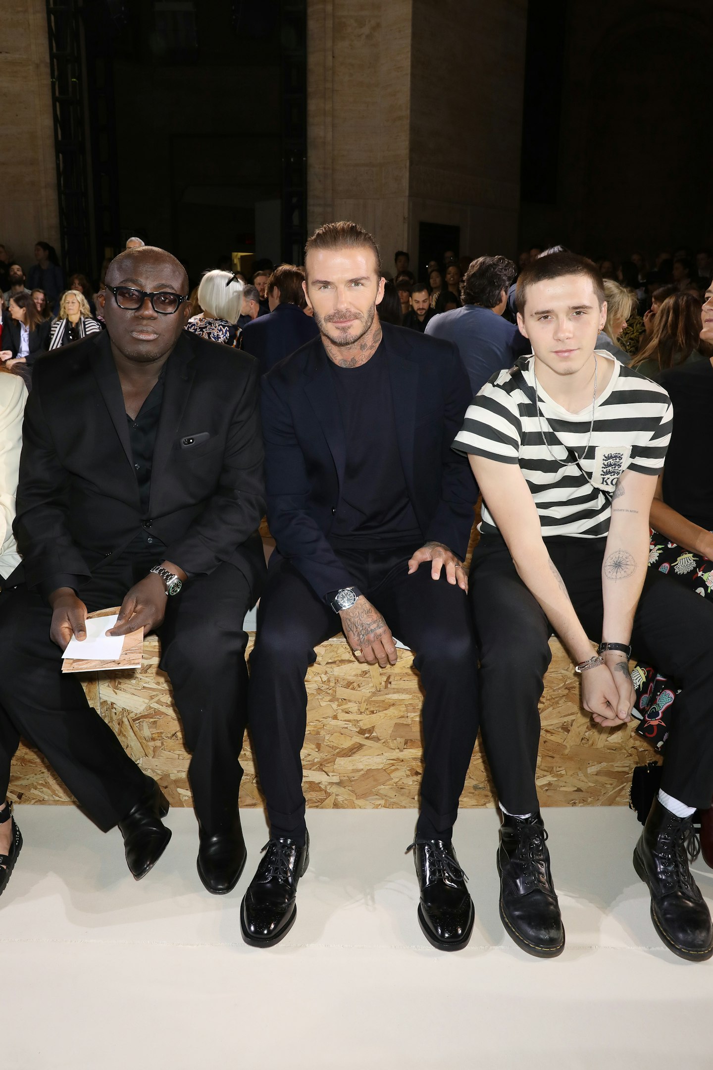 Two Beckhams plus the new editor of British Vogue equals the perfect Victoria Beckham front row