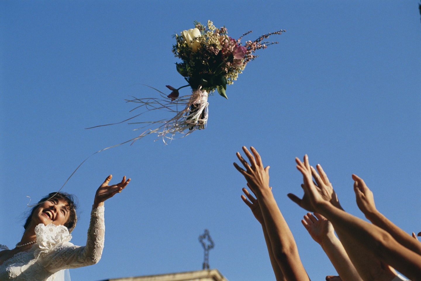 Bride tosses bouquet