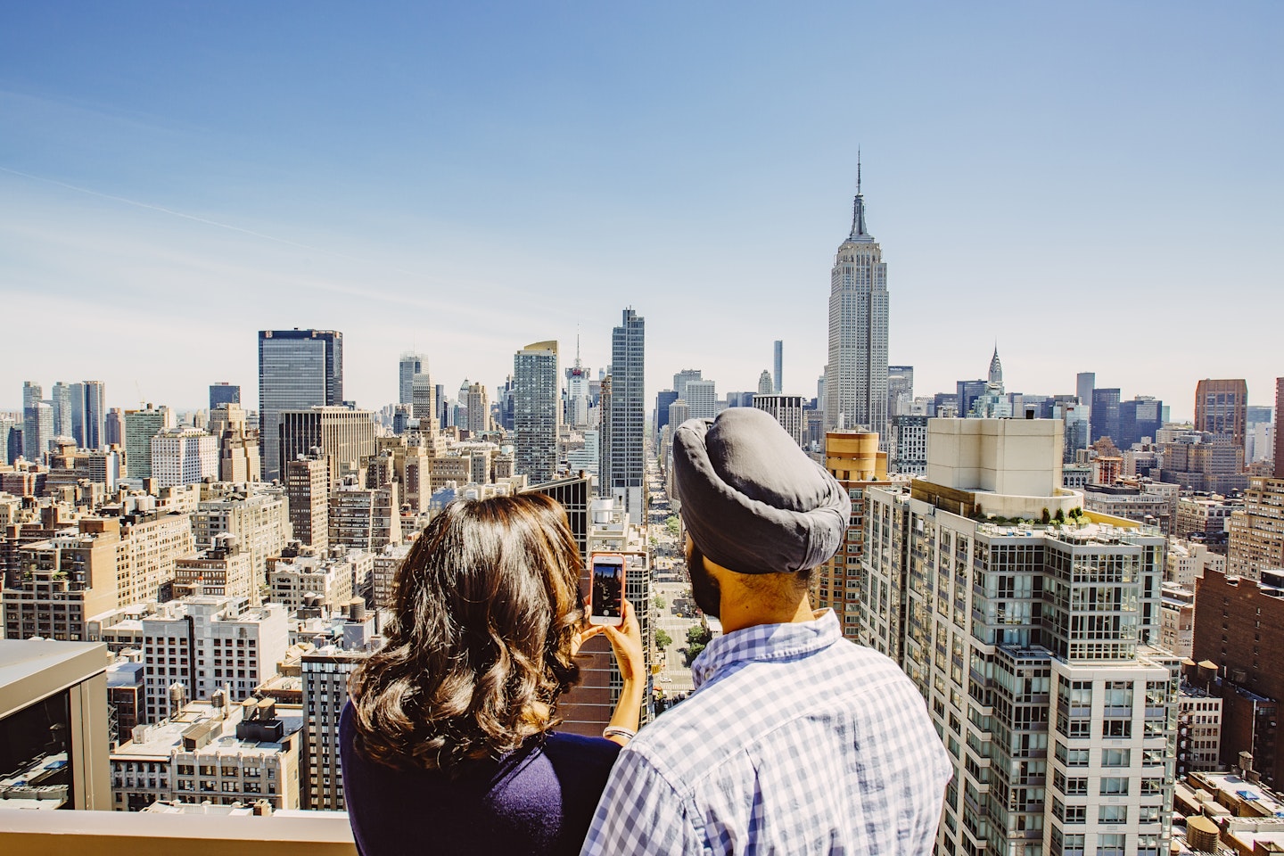 Indian couple looking at NYC skyline