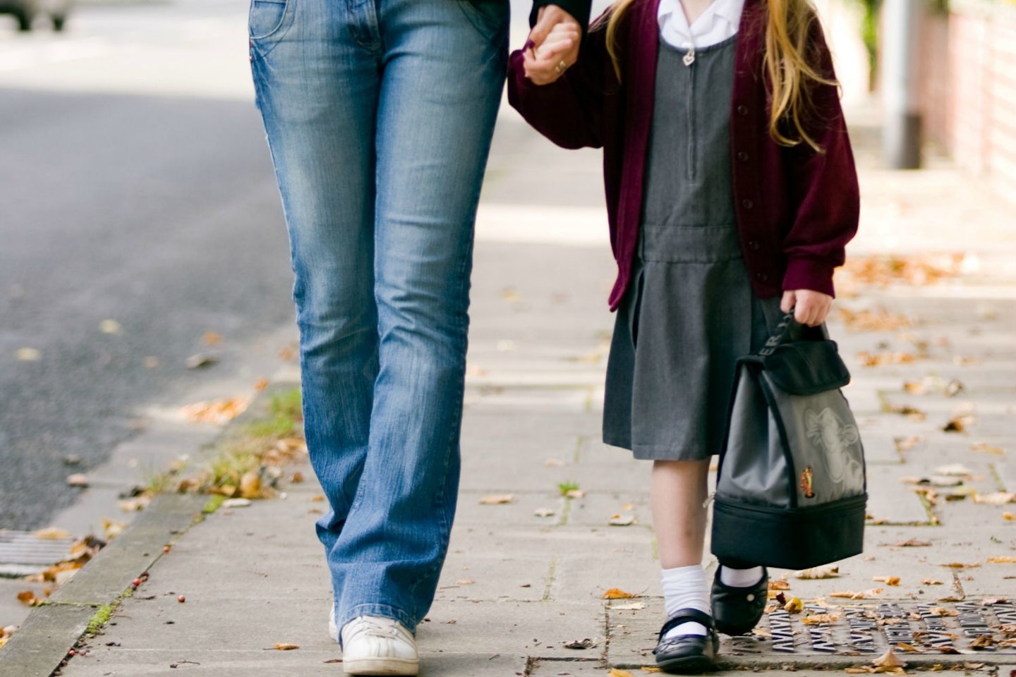 Parent and child walking to school