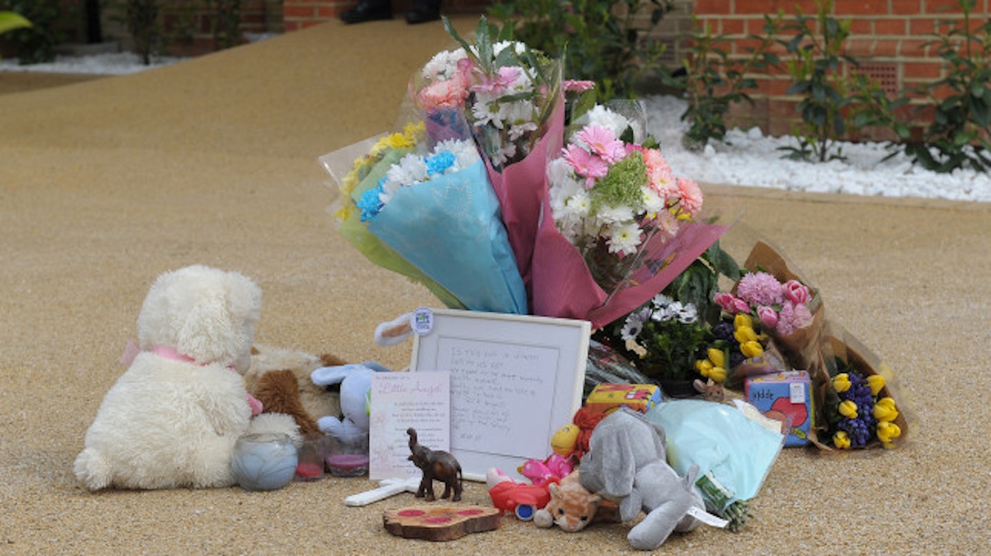 Flowers and toys left outside the house in New Malden