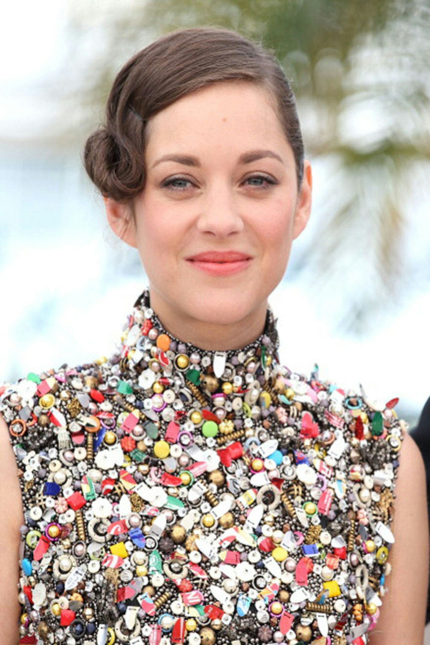 Add interest with an intricate chignon at the side like Marion Cotillard