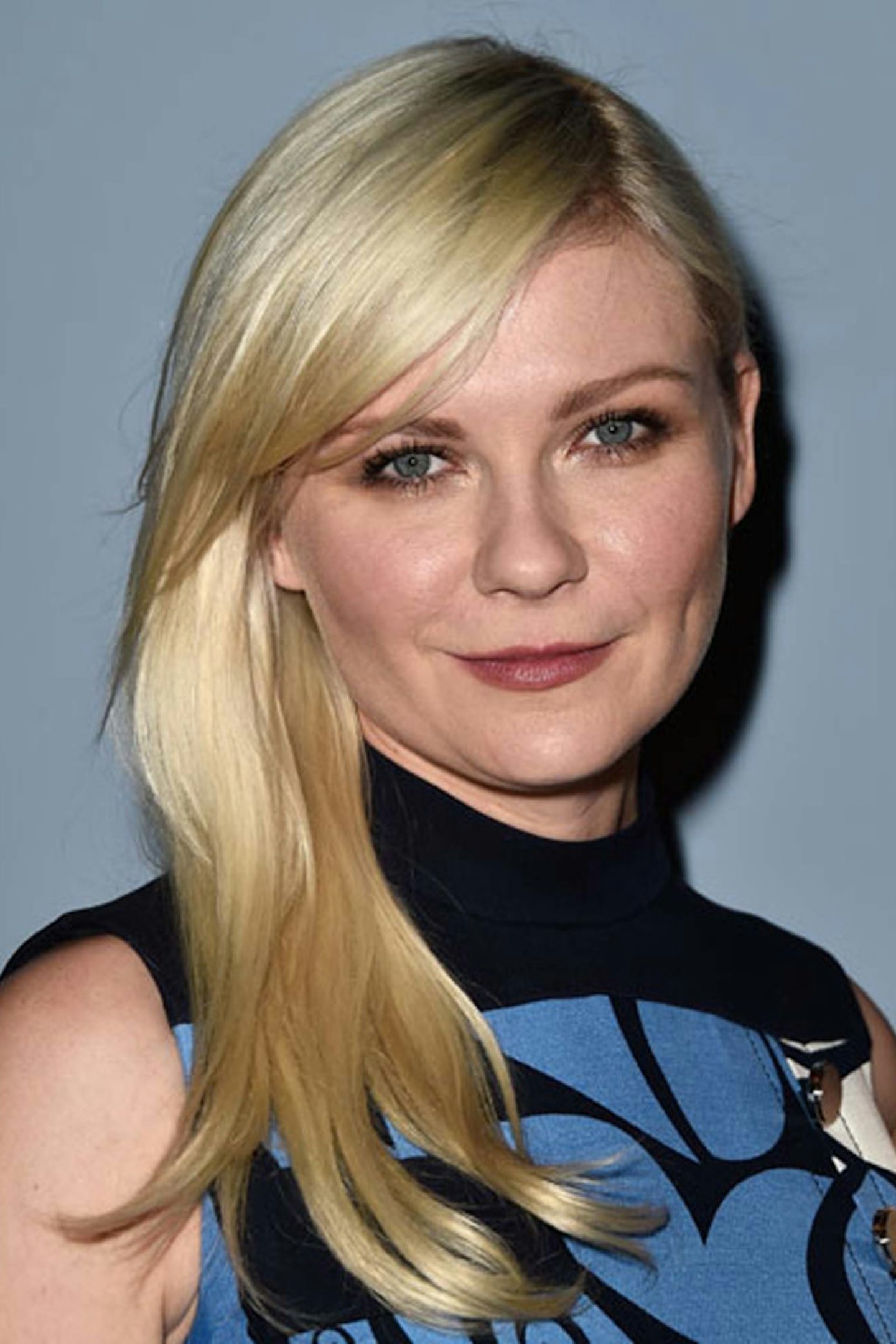 Showcase your blonde hair with a side parting like Kirsten Dunst