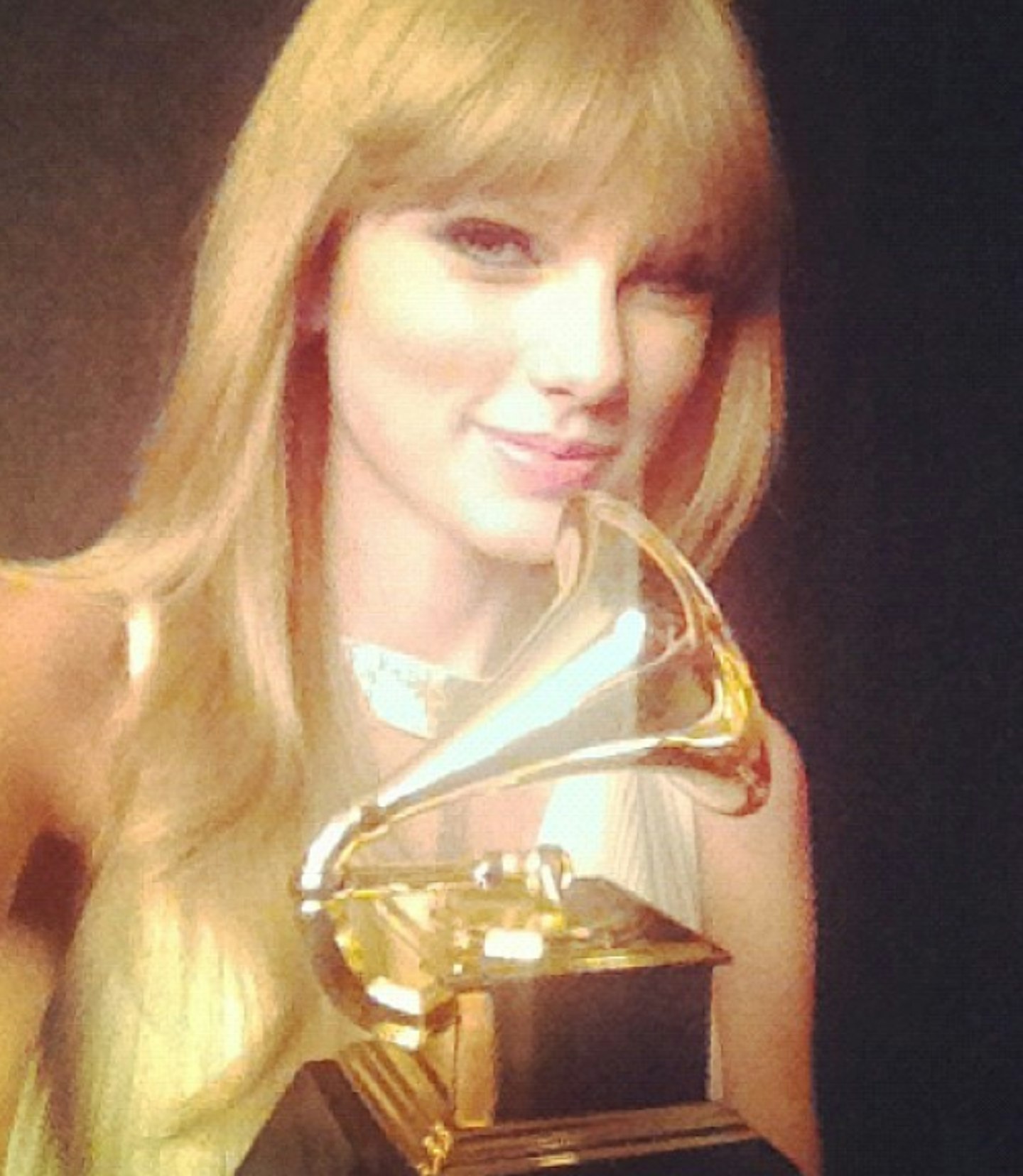 She wins Grammys...