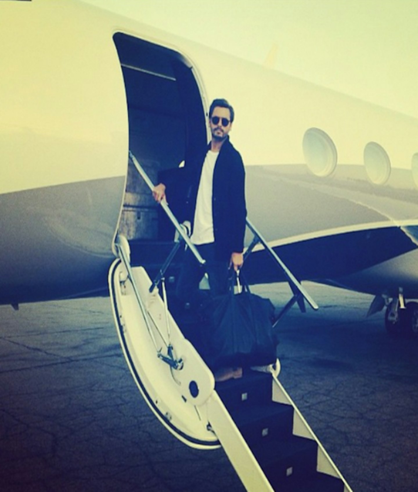 Scott captioned this Instagram snap "Private aviation is my motivation".