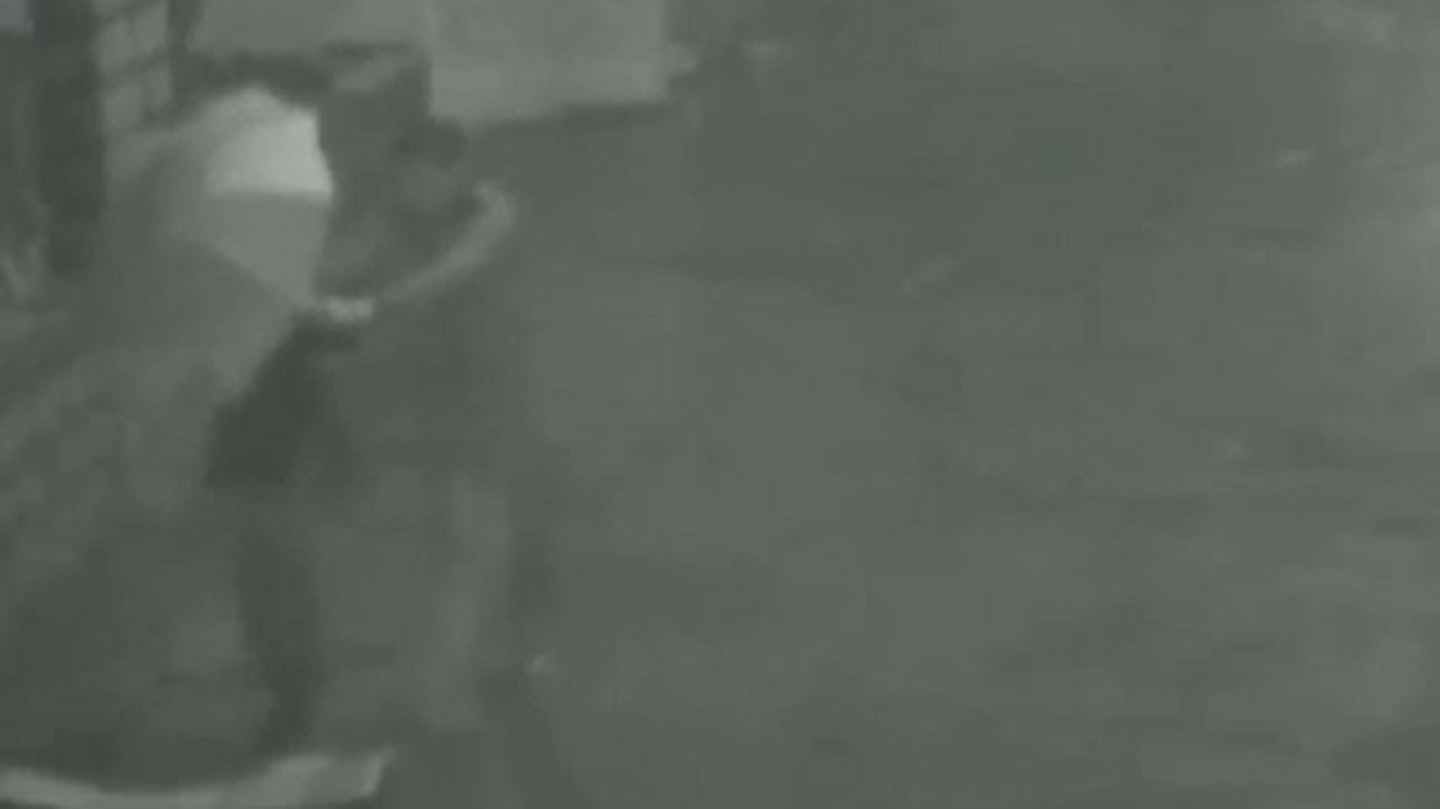The grainy footage shows the man trapping into his girlfriend in a manhole.