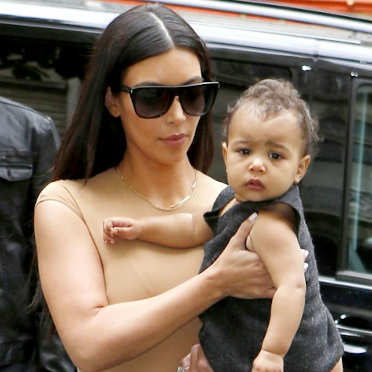 Kim pictured with a slightly grumpy but gorgeous looking North West in Paris yesterday