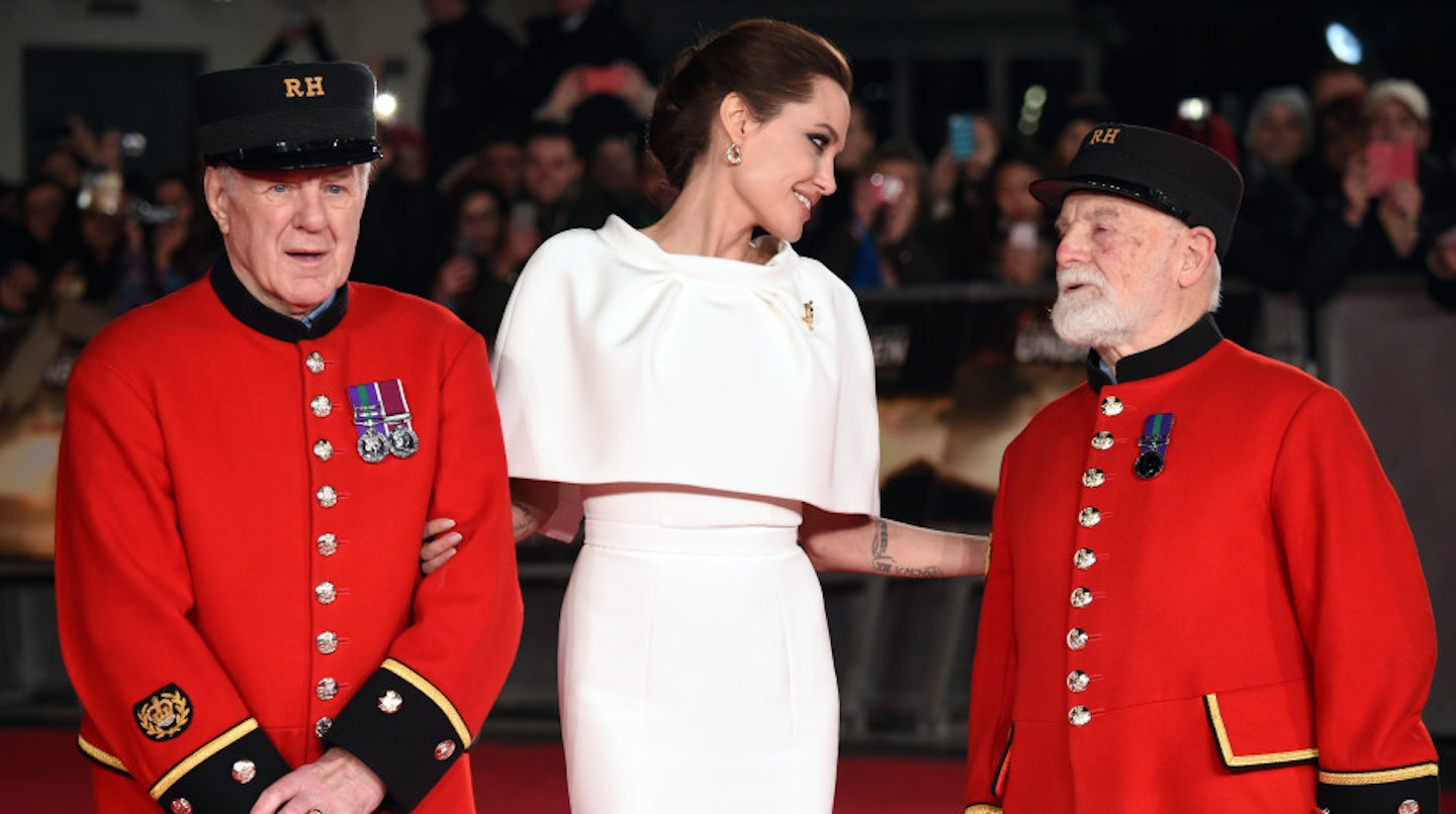 Angelina chats with some Chelsea Pensioners on the carpet