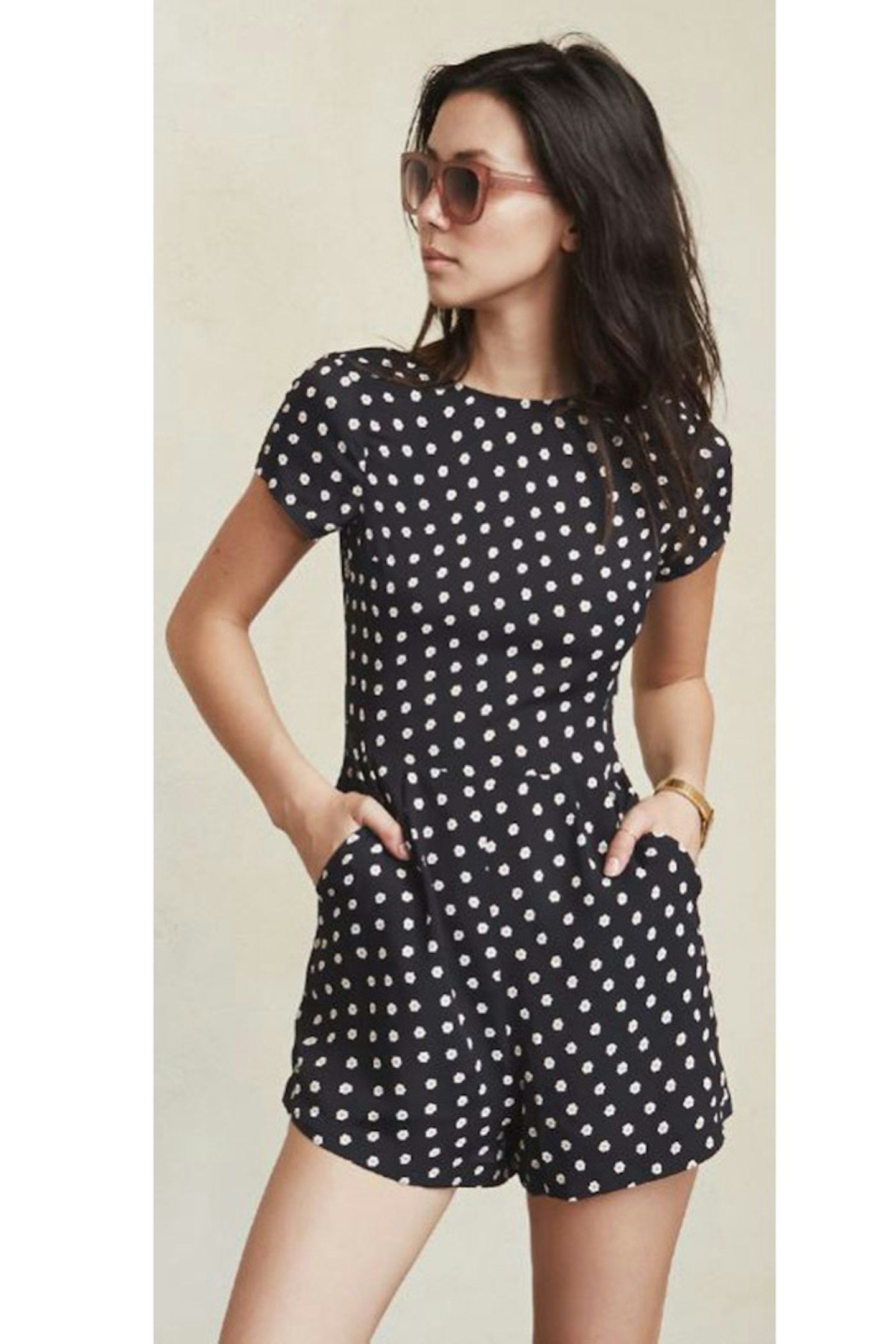This polka dot playsuit has a tie up back to add a little sass to your summer wardrobe.