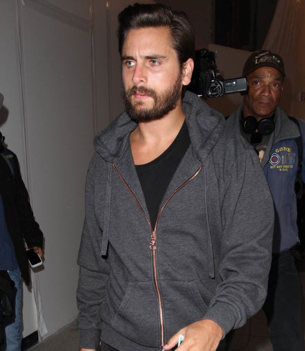 Scott Disick posts picture in bed with someone before deleting it AND