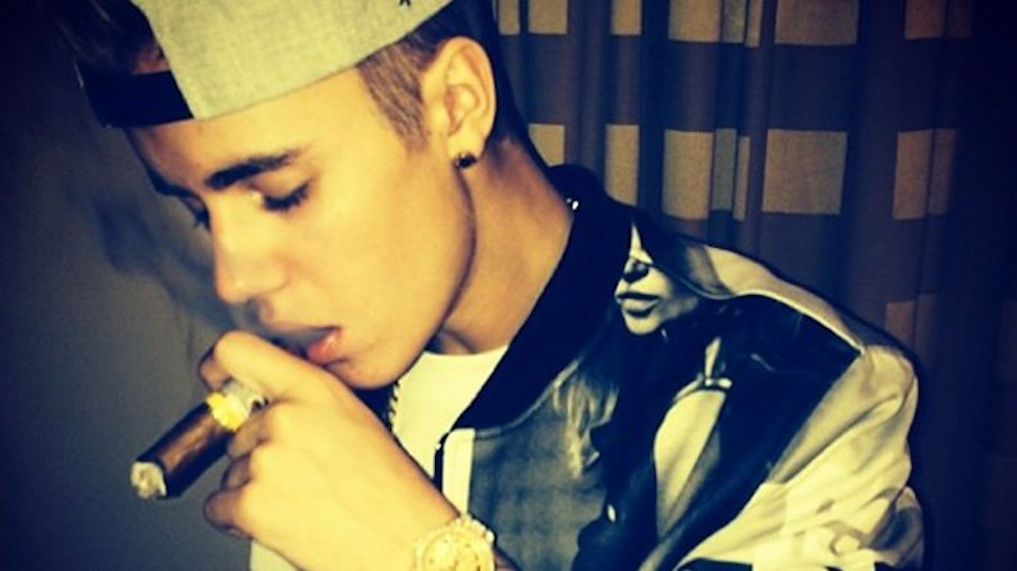 Justin posted this pic of himself smoking a cigar.