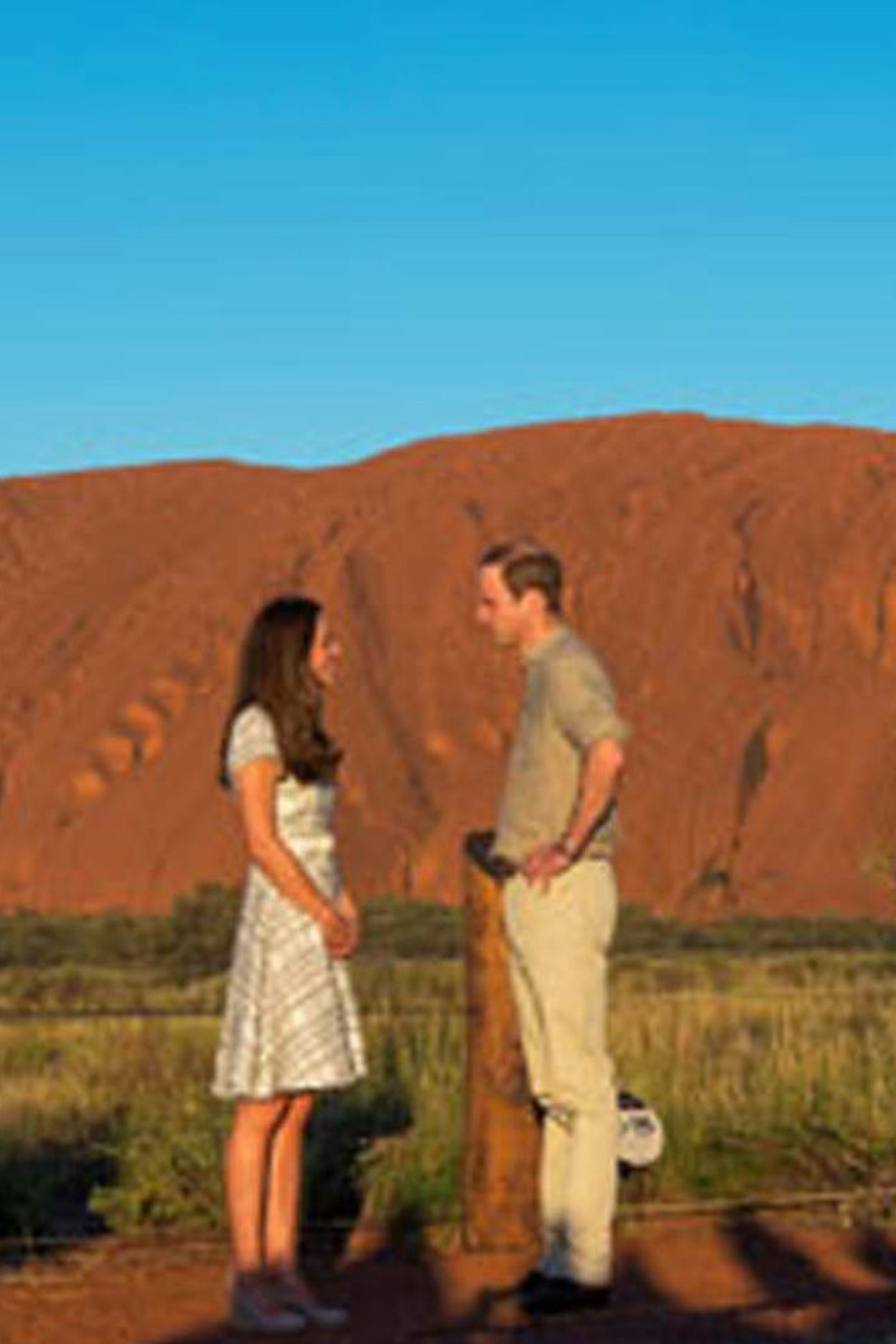77- 76. The couple at a quick photocall at the base of Uluru