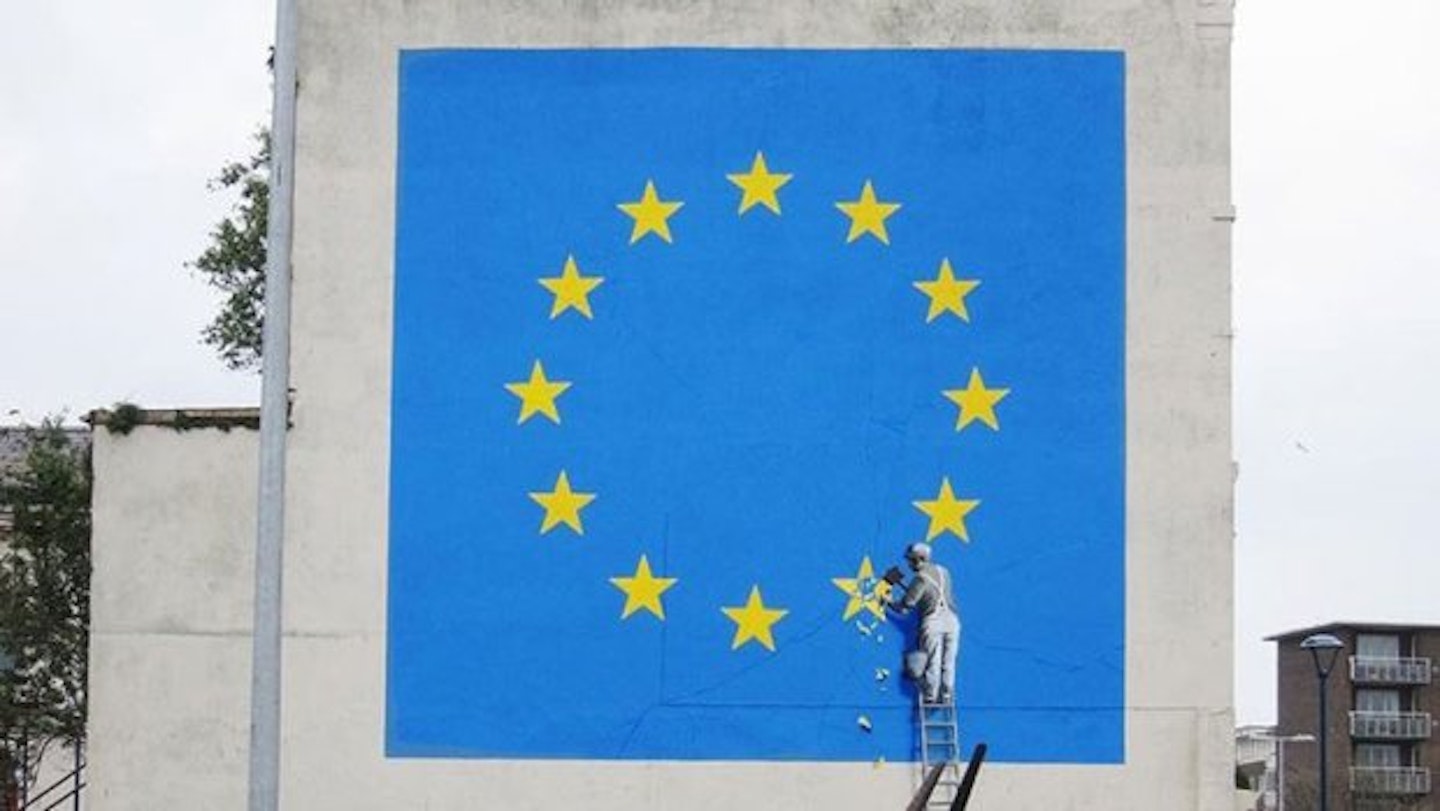 Banksy's Brexit Mural Of A Man Chiseling Away At The EU Flag