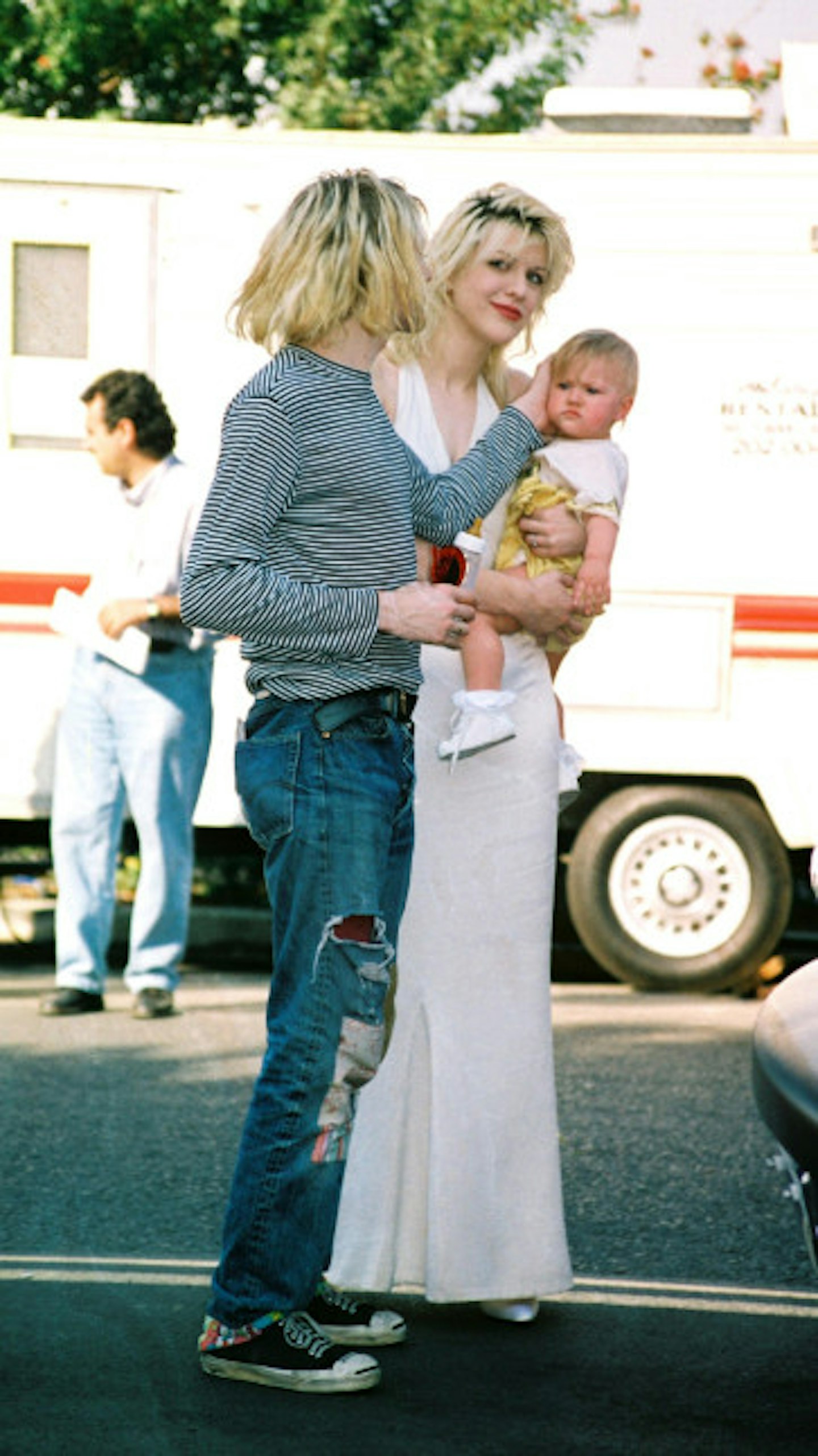 Kurt Cobain and Courtney Love with their baby daughter