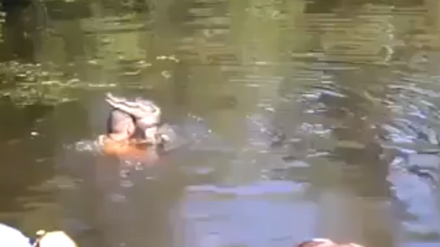 The brave (?) man gives his croc a hug