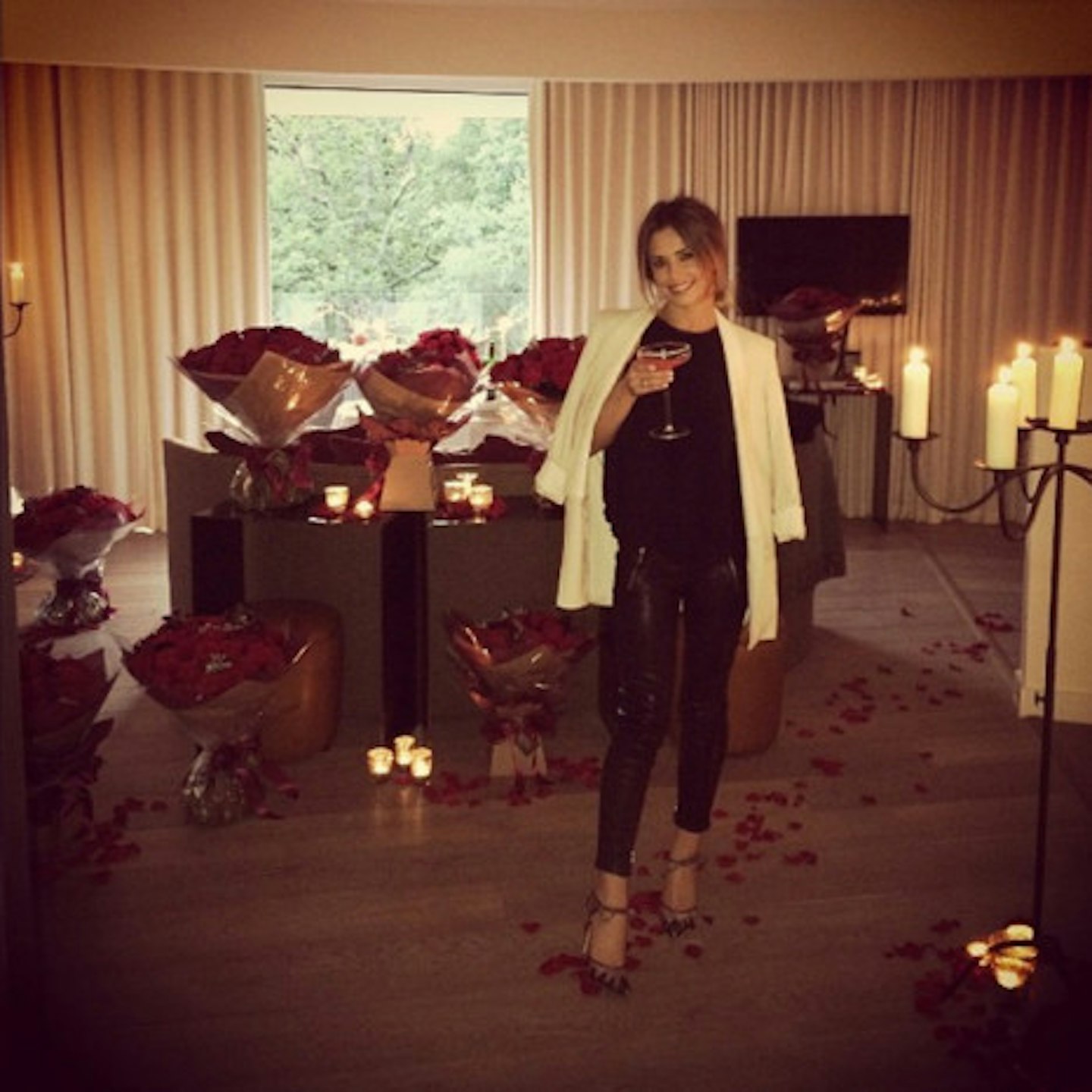 Cheryl posted this picture of her surrounded by candles and roses