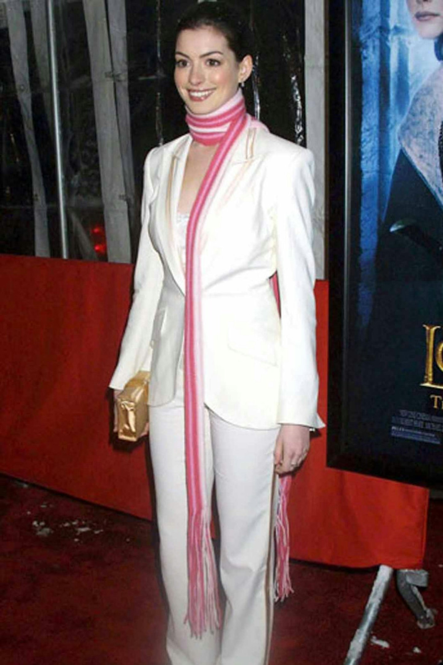 Anne Hathaway 2005 style pink scarf white suit