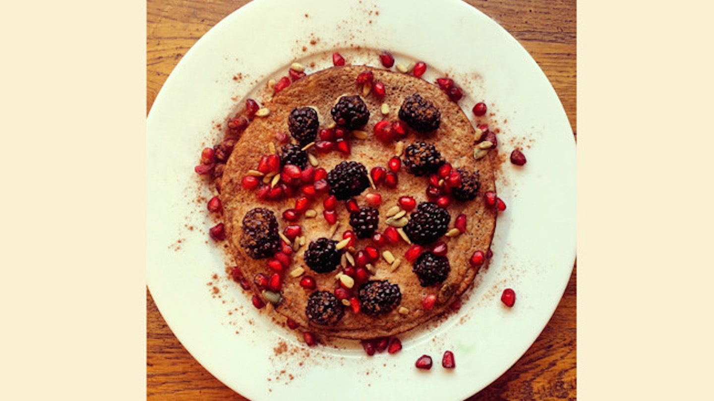 Breakfast: Chocolate and banana protein pancake with blackberries and pomegranate seeds