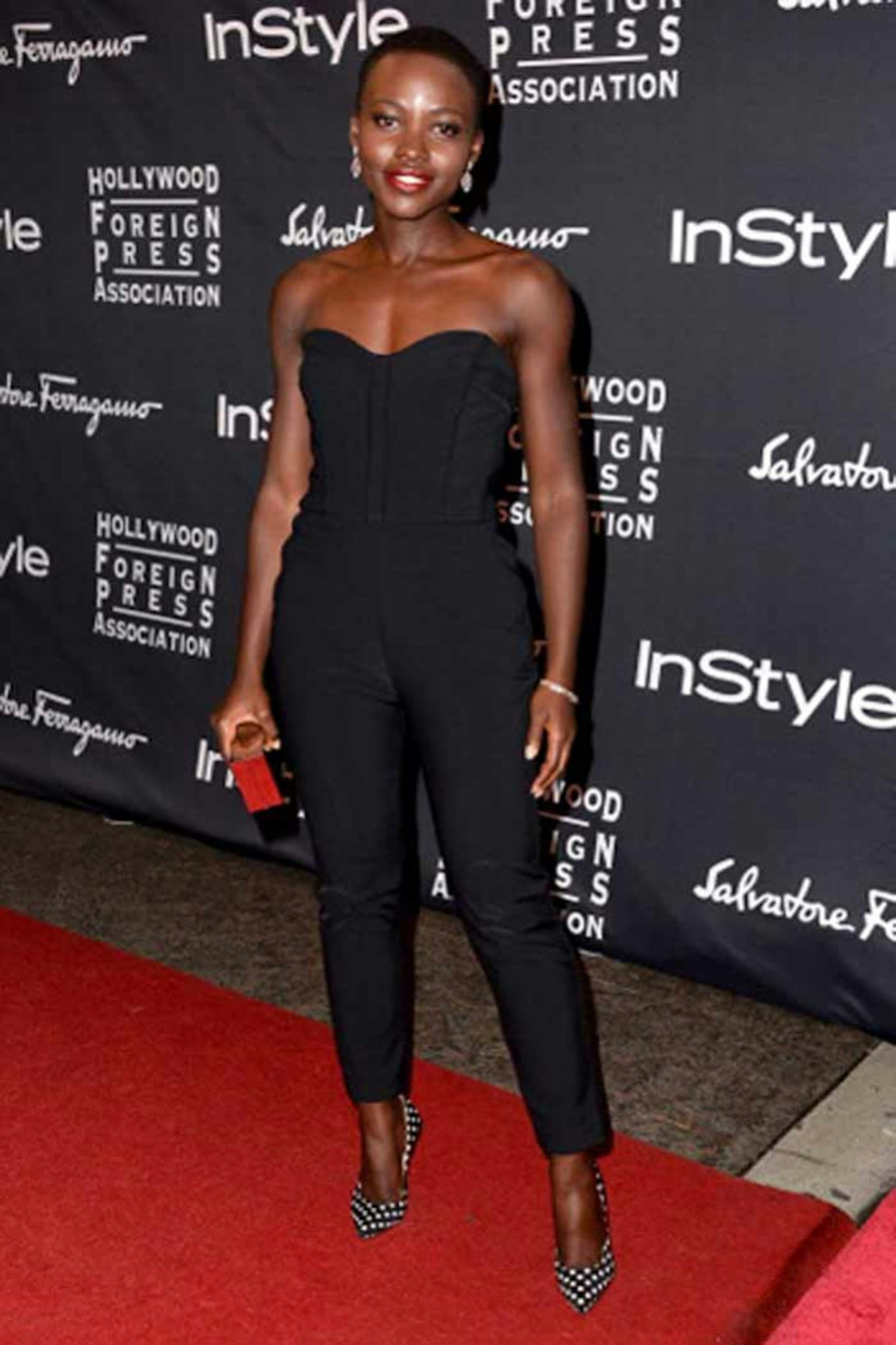 Wearing a black jumpsuit by Victoria Beard at a Toronto Film Festival Party, August.