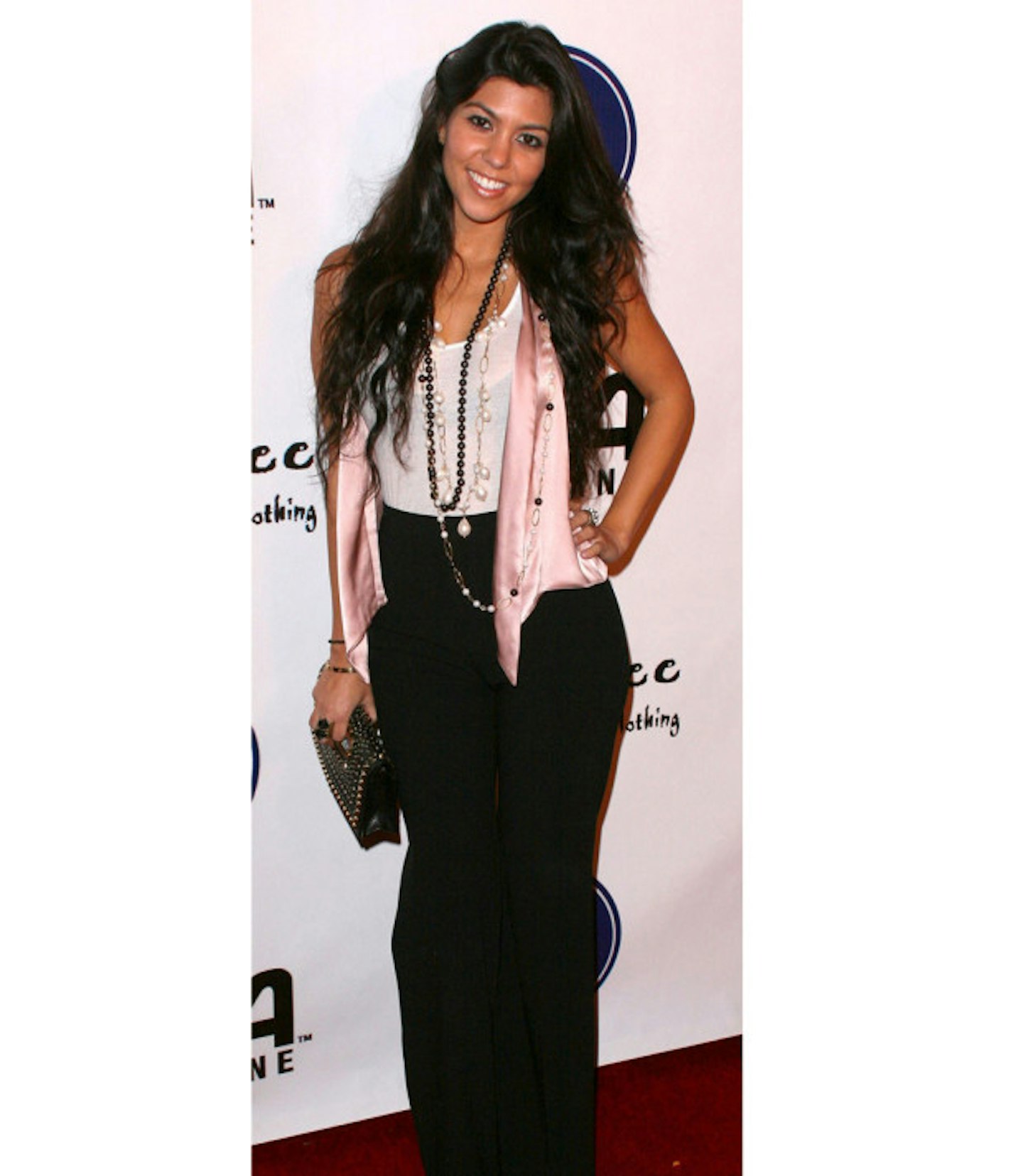 kourtney-kardashian-fashion-disaster-black-jeans-pink-silk-waistcoat