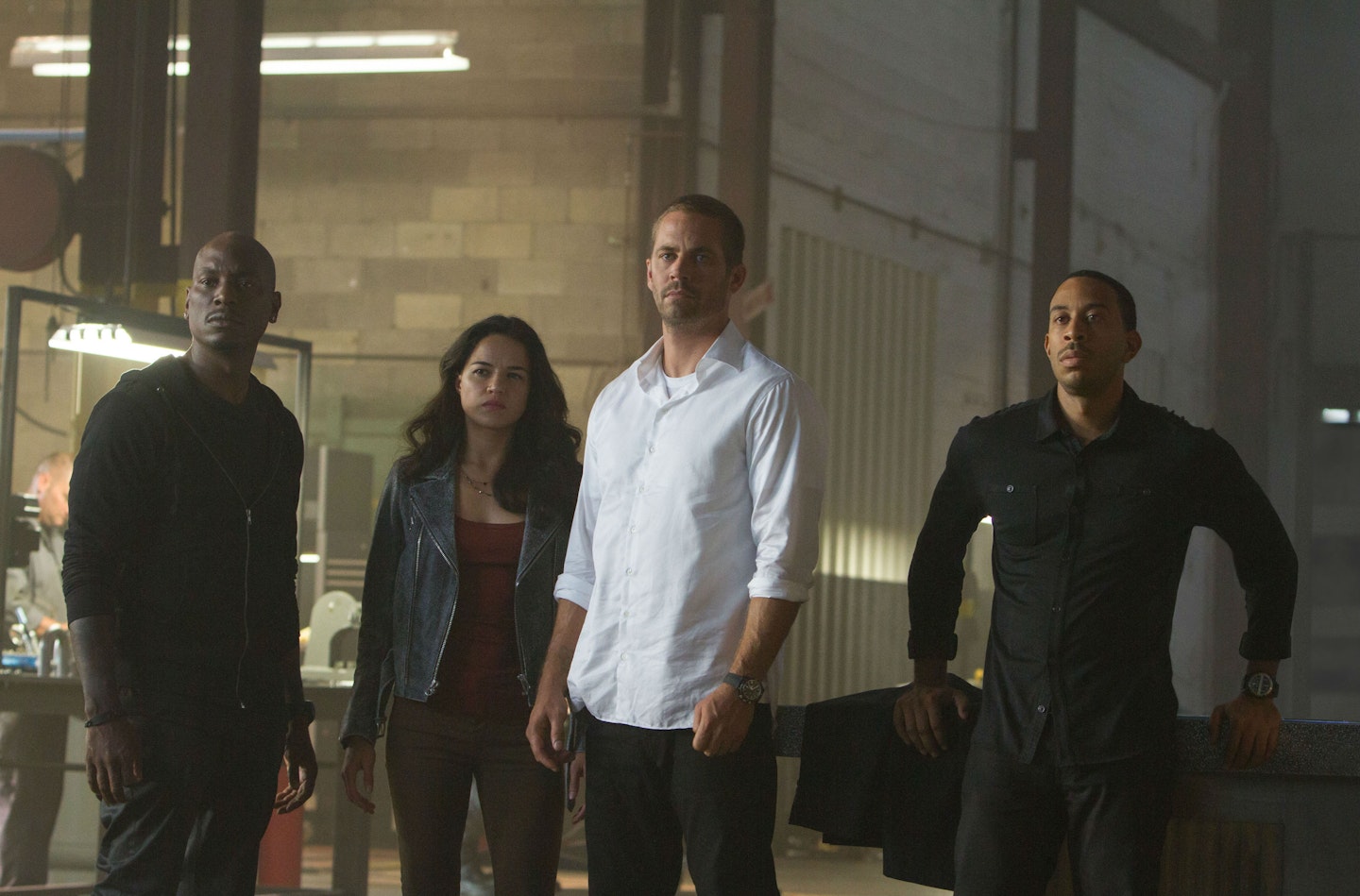 The late Paul Walker on set for Furious 7 with co-stars Tyrese Gibson, Michelle Rodriguez and Ludacris.
