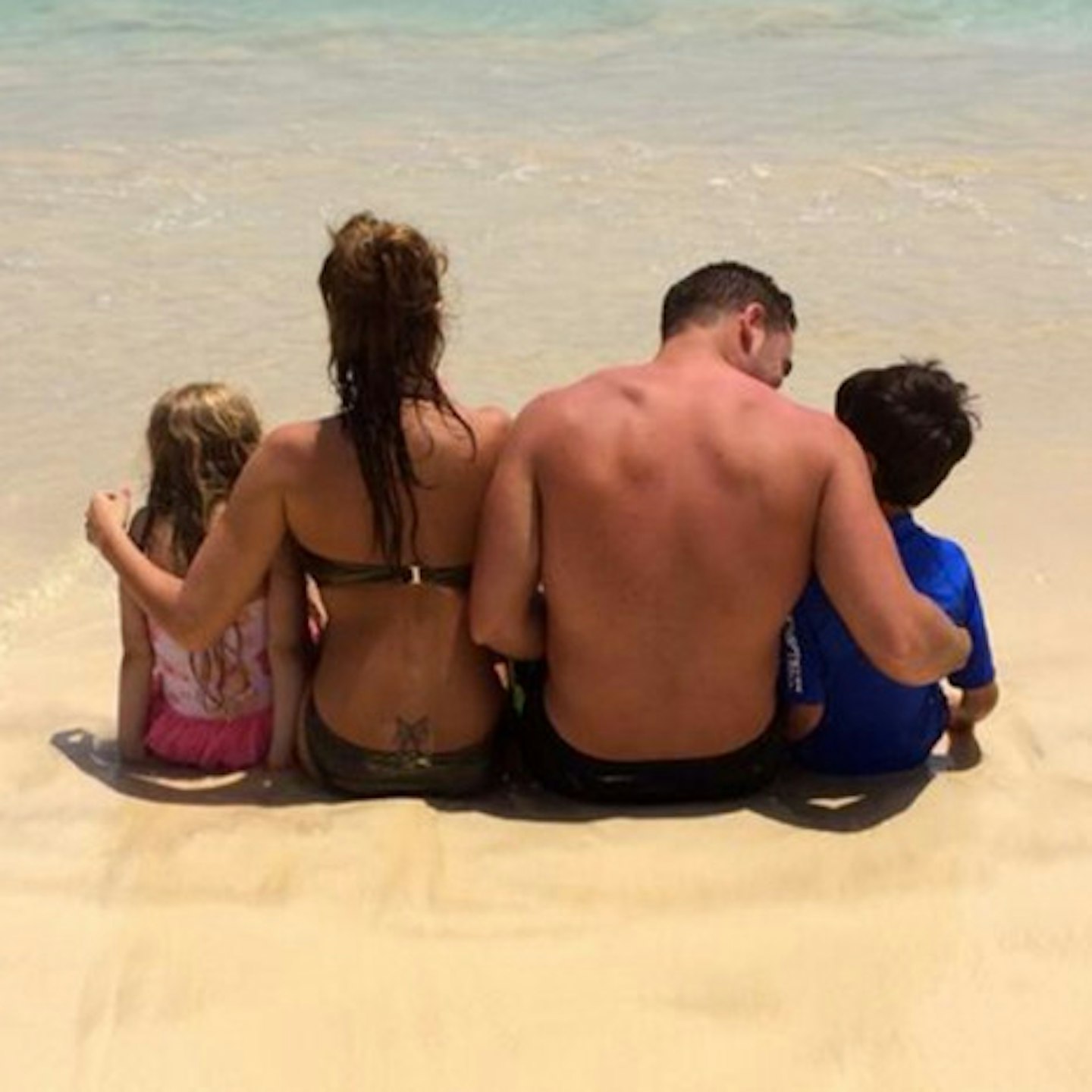Katie posted the snaps of her family enjoying the beach
