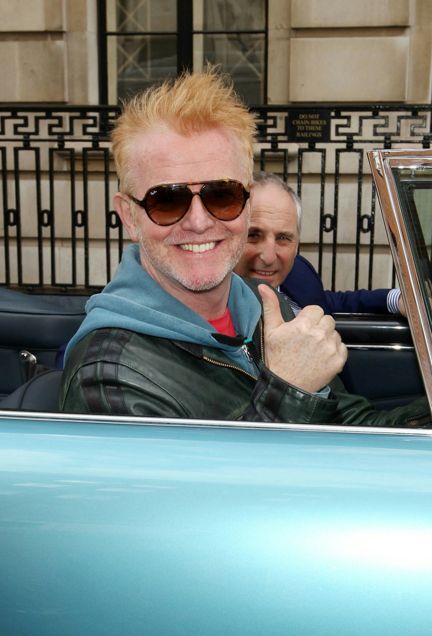 The only way he can hold his thumb aloft is by carefully parking up and switching off the engine first