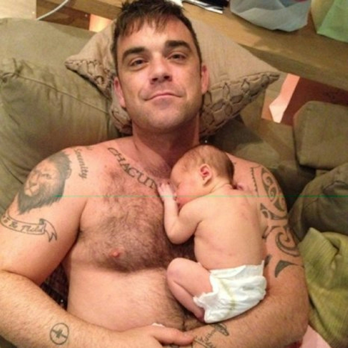 Robbie Williams adores his baby daughter