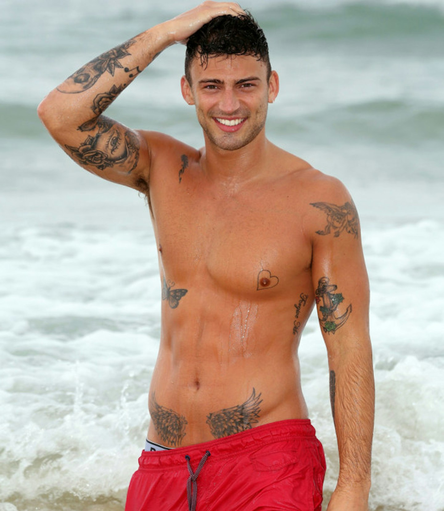 Jake Quickenden using his toned body to part the sea