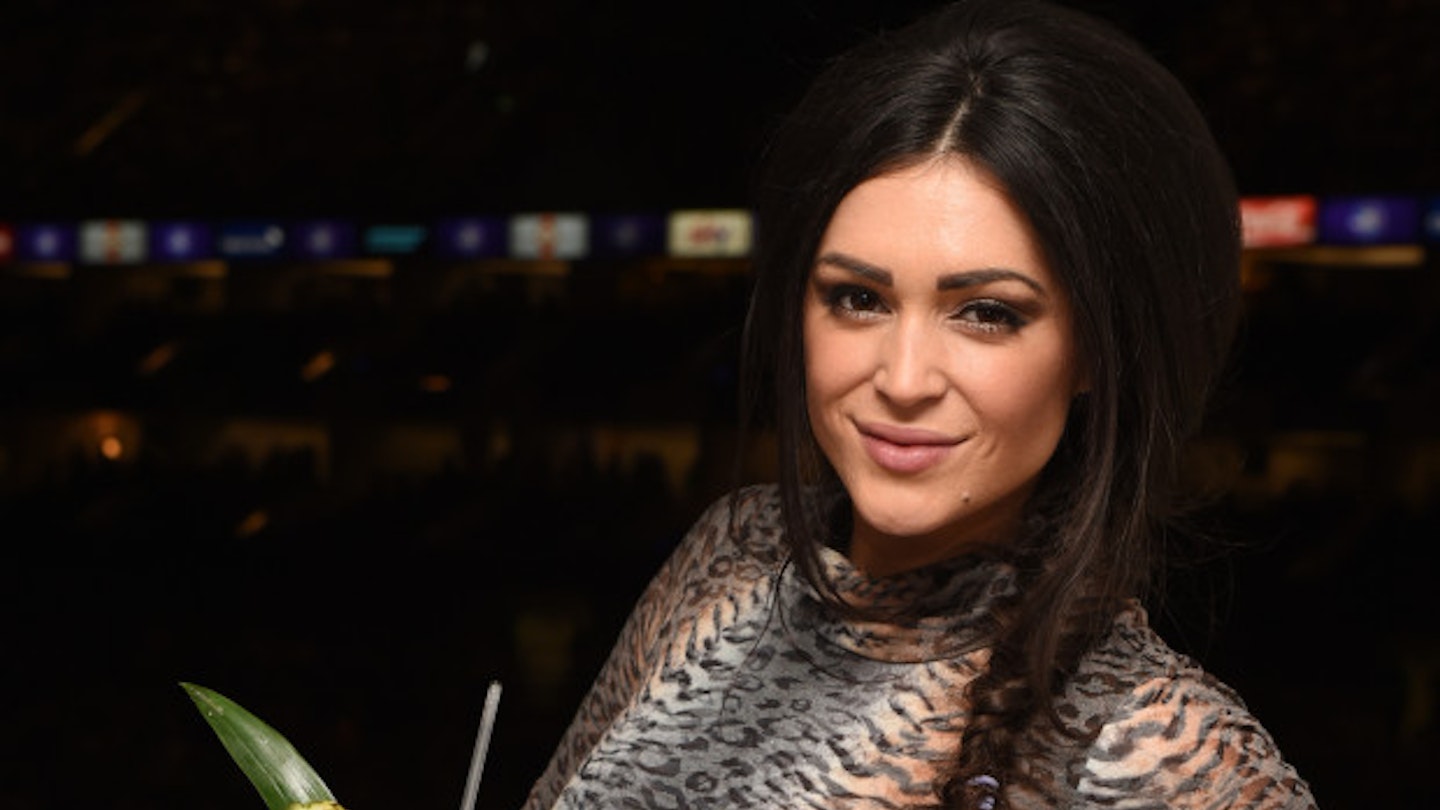 Casey Batchelor enjoying a Pina Colada in the Malibu Rum suite at Olly Murs at the O2.