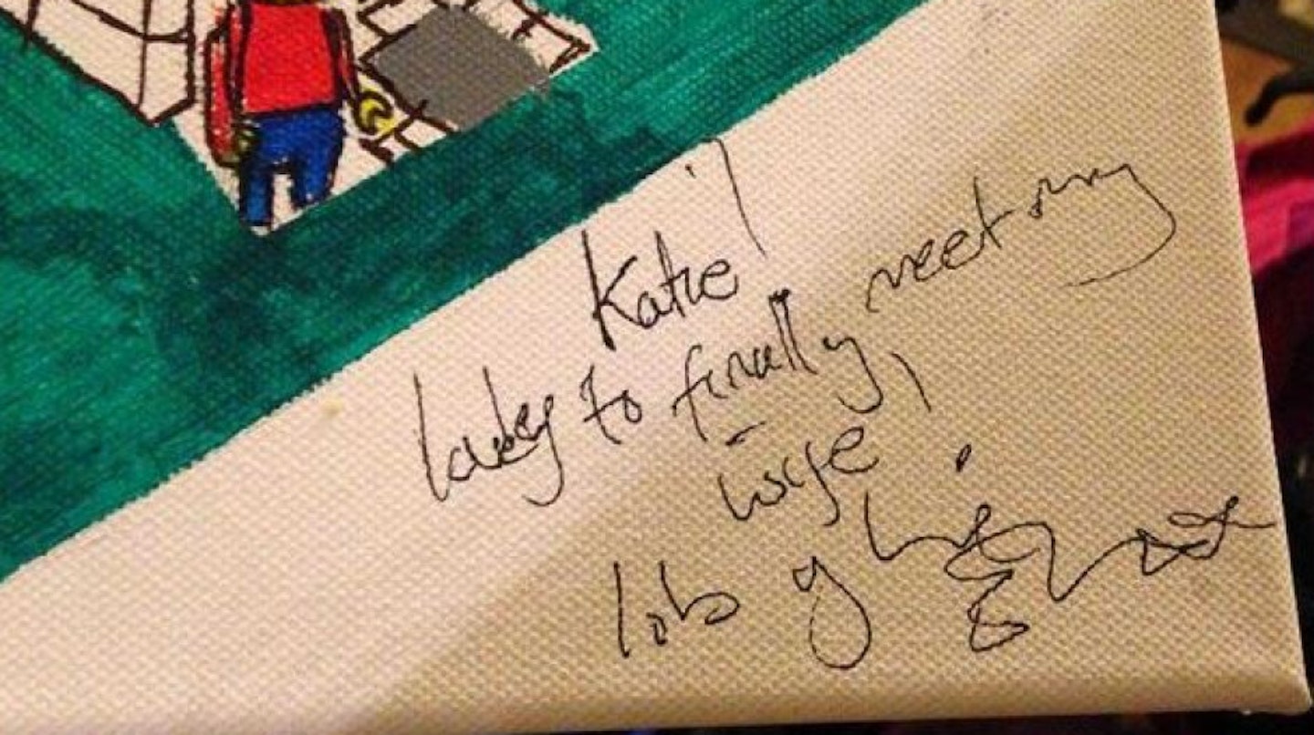 Ed signed the Lego House painting for Katie