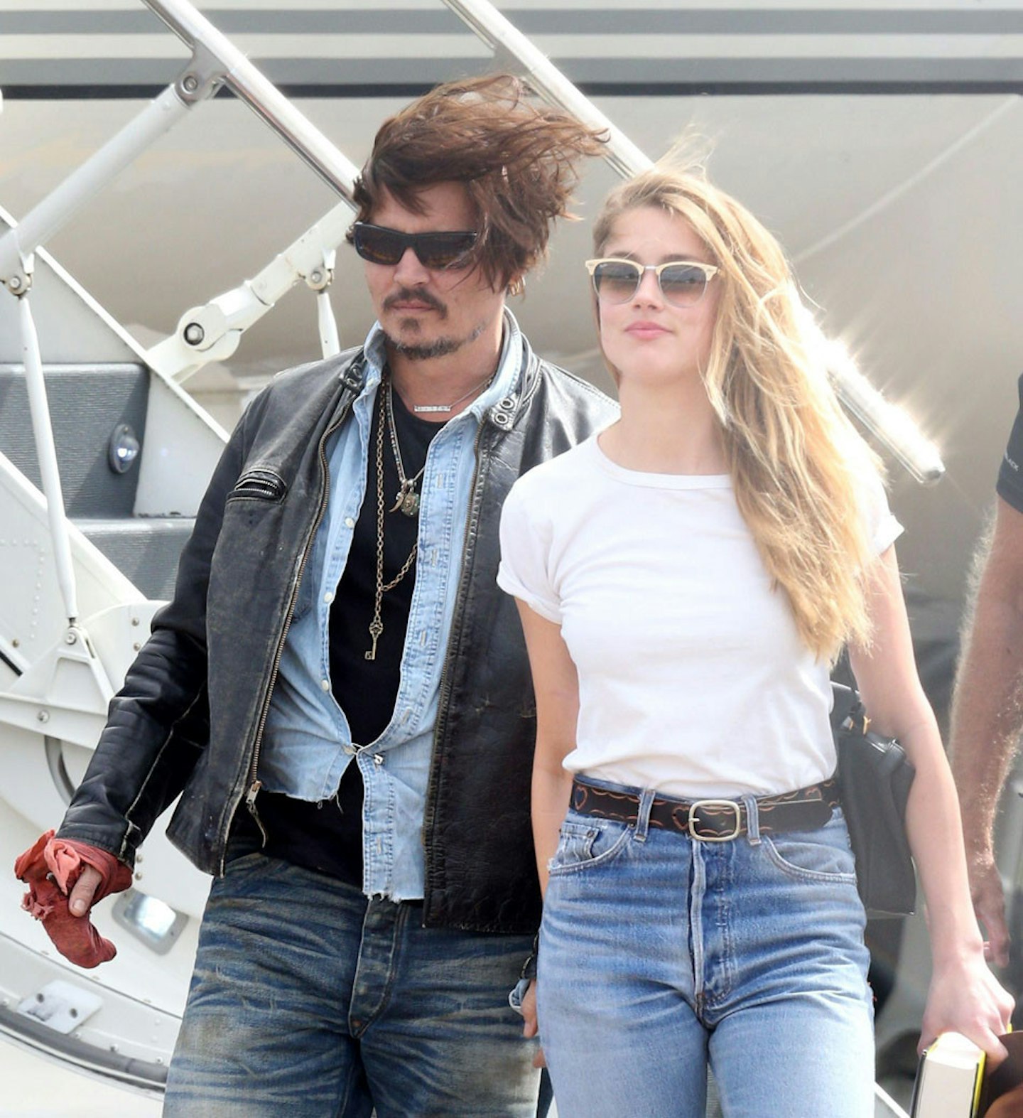Johnny and his wife Amber Heard arriving at Brisbane Airport, Australia last month.