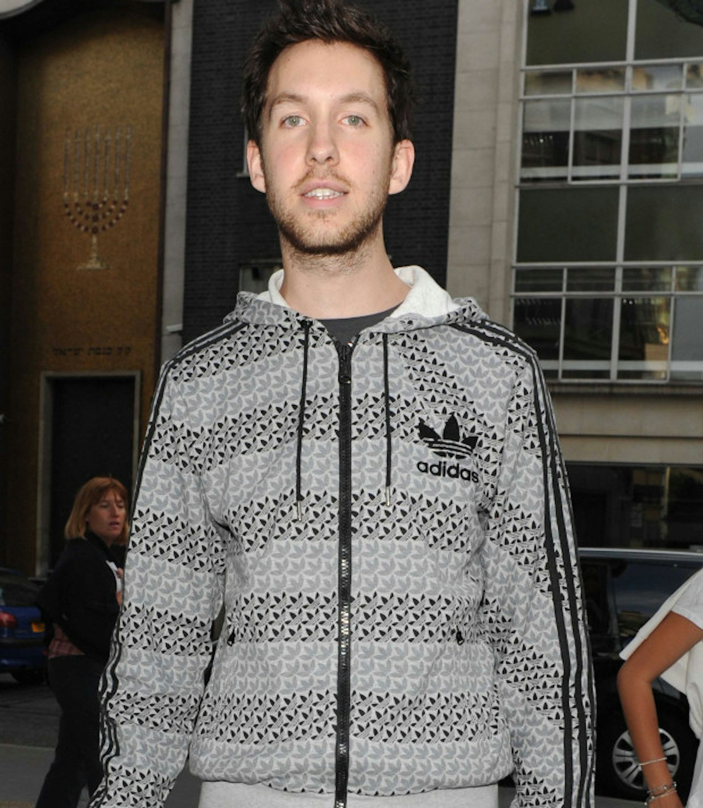 Before expensive hair cuts, Calvin matched his Adidas hoodie with a gentle layering of stubble
