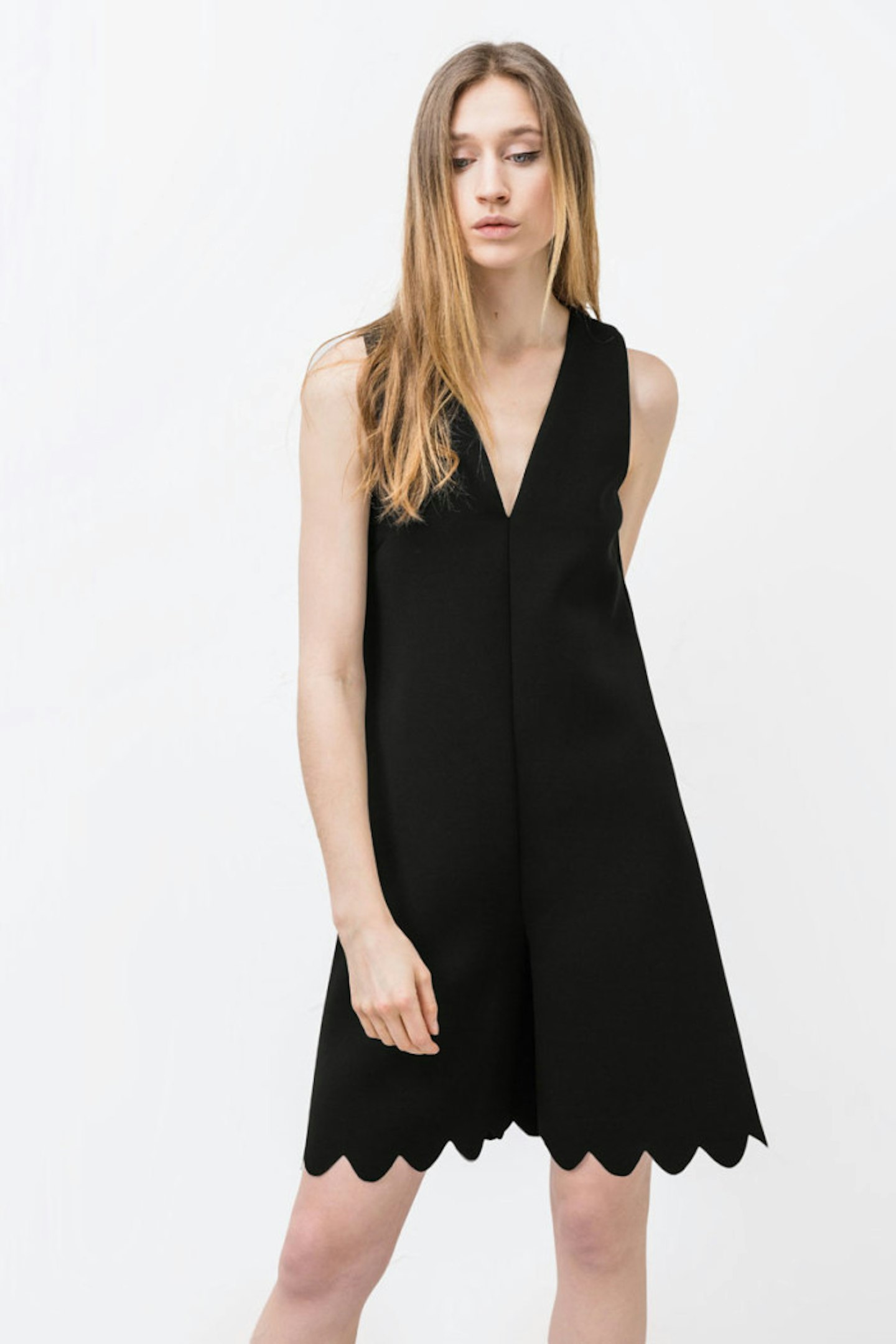This black playsuit with scalloped edge is the perfect pieces to take you from day to night.