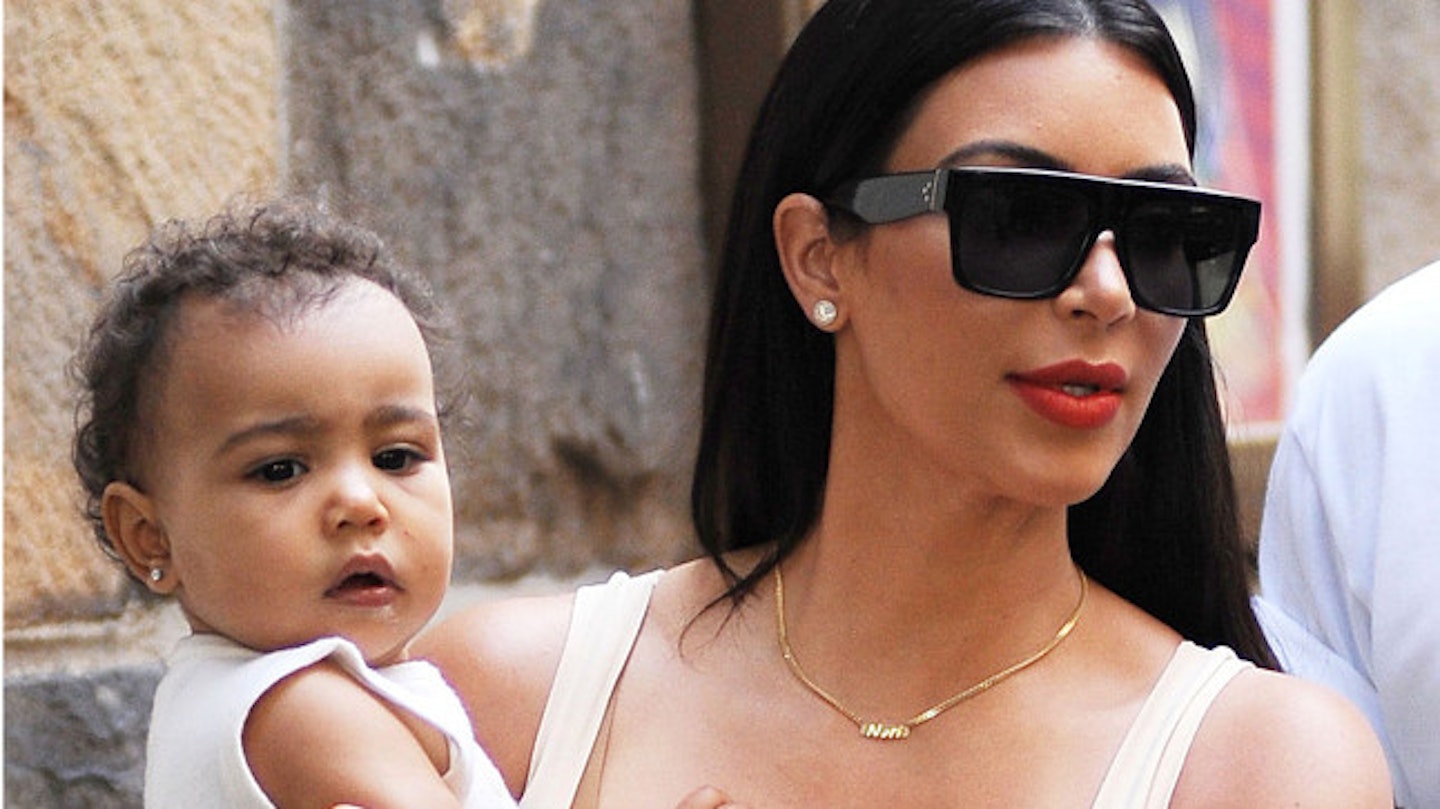 North was pictured with her mother Kim Kardashin with diamond earrings