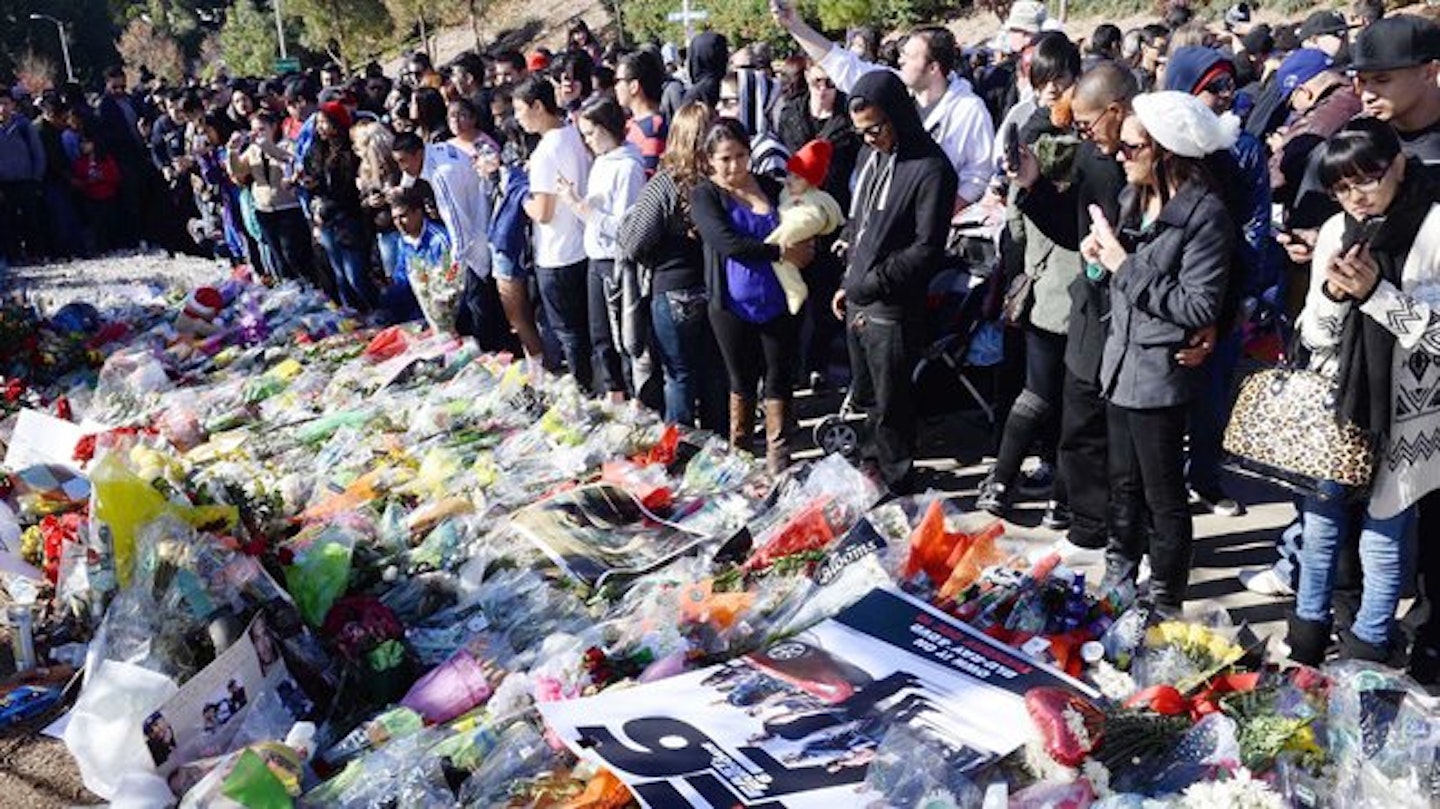 Fans of the Hollywood star lay flowers near the site of the fatal crash.