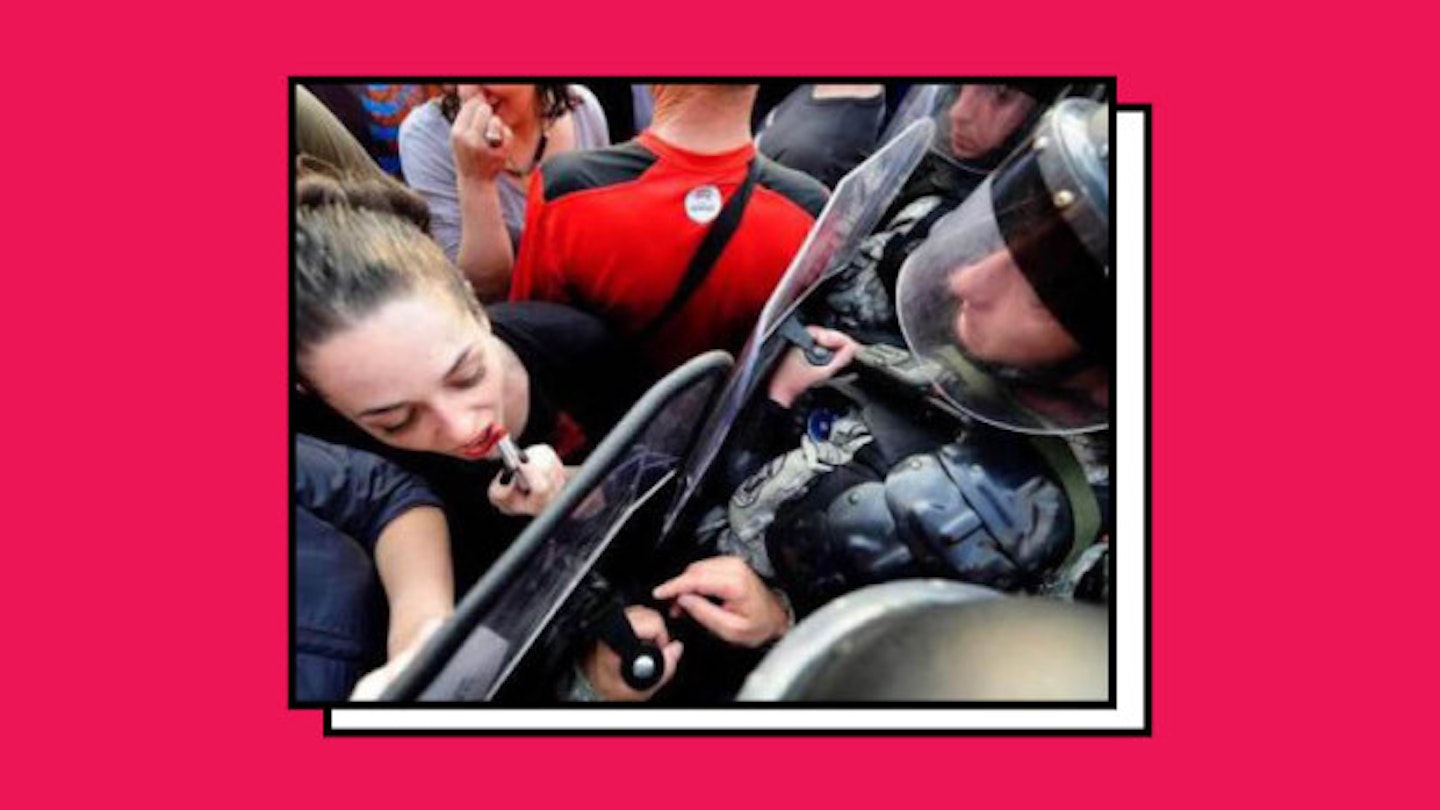 Woman Makes Lipstick Mark On Anti Police Protests