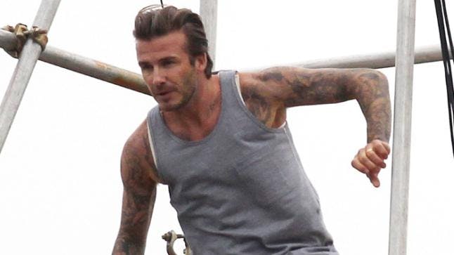 David Beckham clambers over London roof in his pants for latest