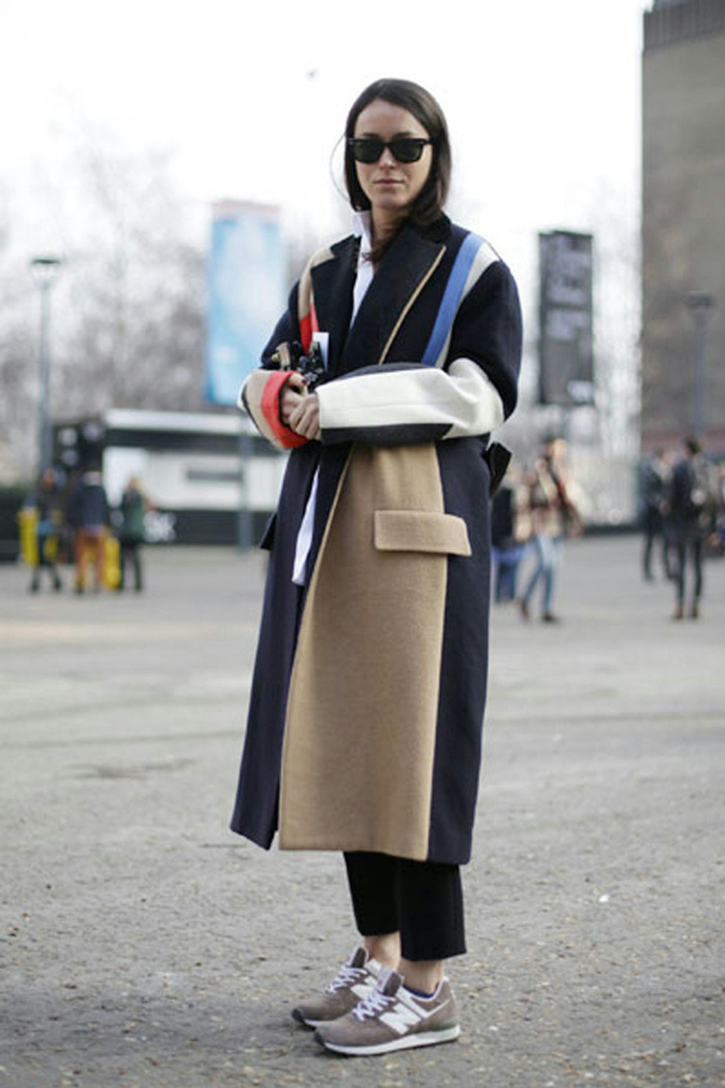 Alex Eagle wearing a Celine coat with Joseph trousers and New Balance trainers