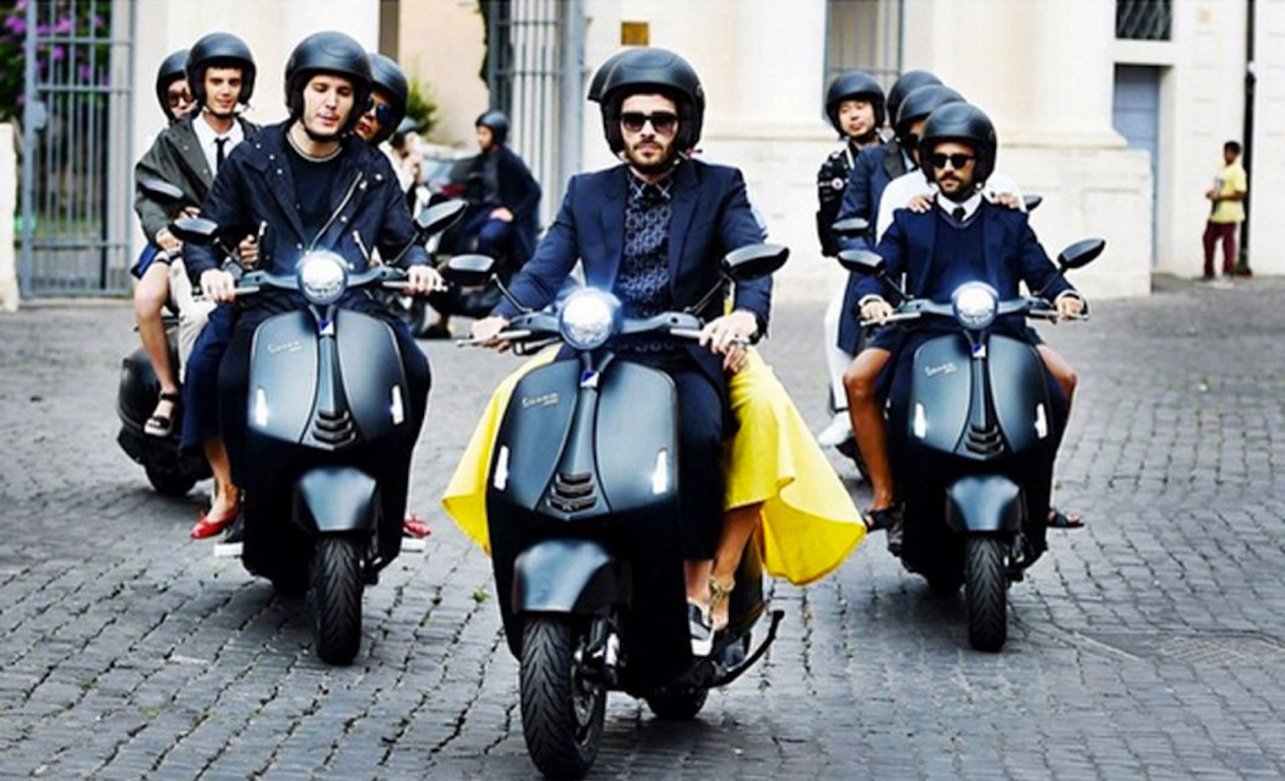 Two male models on Vespa 946 Emporio Armani Style scooters