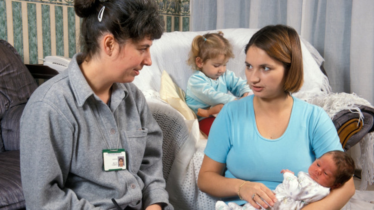 A midwife makes a home visit (stock image)
