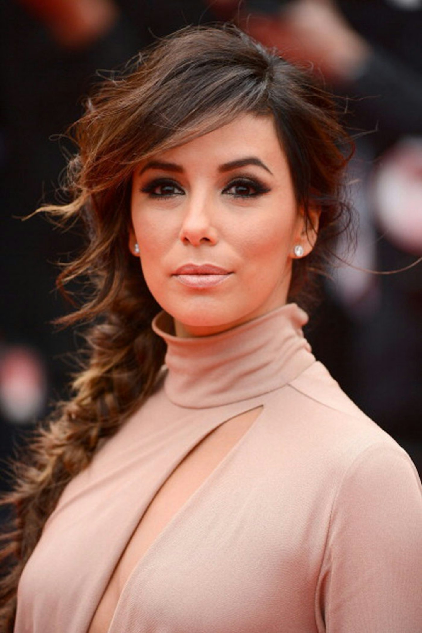 Try a mussed-up plait like Eva Longoria