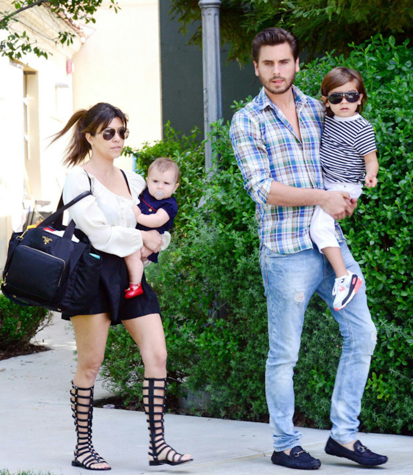 Kourtney and Scott with Penelope and Mason in 2013