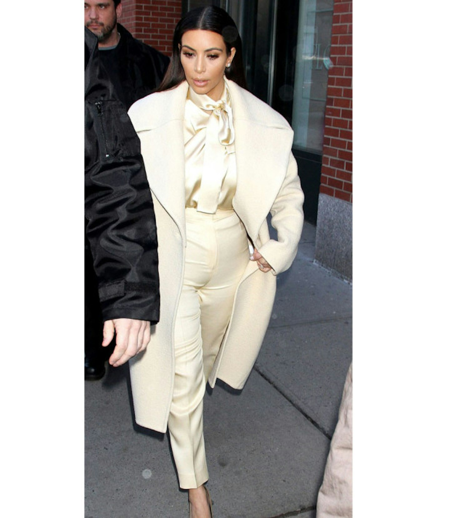 kim-kardashian-fashion-disaster-cream-coat-suit-bow