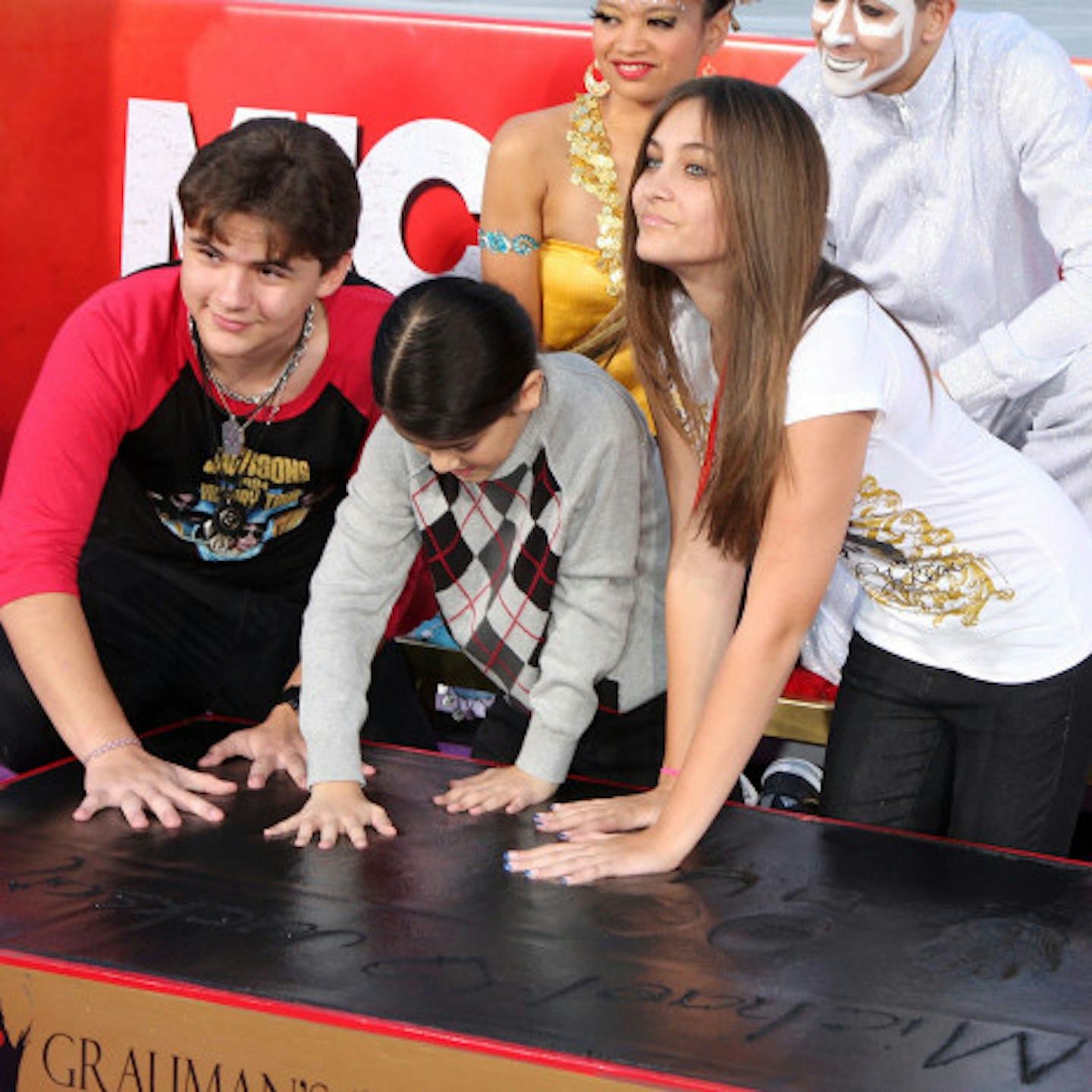 Paris Jackson with brothers Prince and 'Blanket' immortalise their late father outside the historic Grauman's Chinese Theatre (2012)