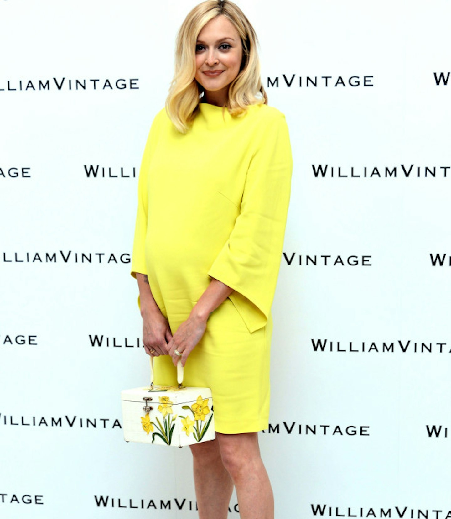 Bright yellow, again another iconic bag to add to the simplistic dress.