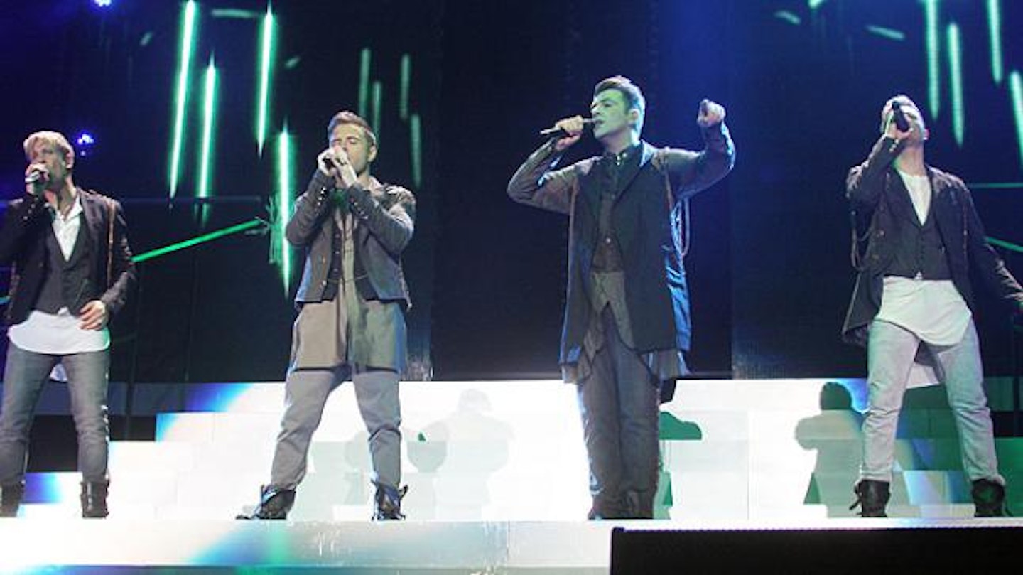 Shane on stage with Westlife band-members Nicky Byrne, Mark Feehily and Kian Egan during their 2012 Farewell tour