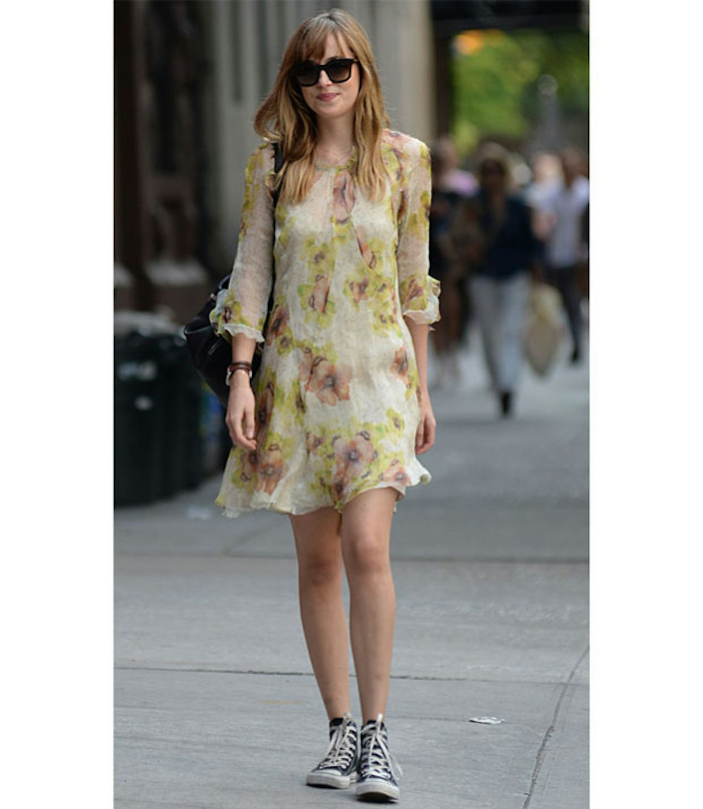 Perfectly dressing down her floral frock with scuffed Converse