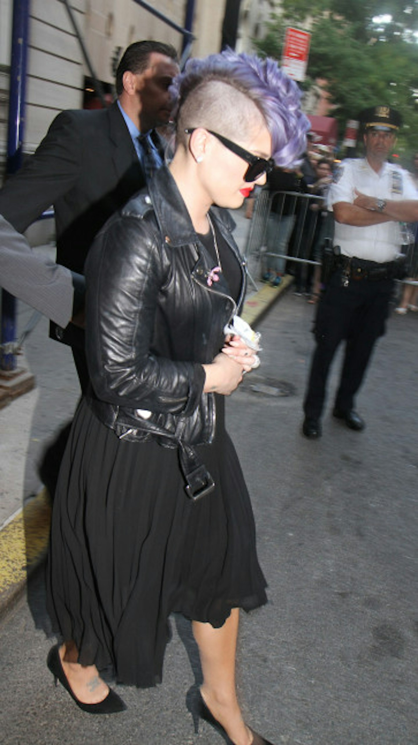 Kelly Osbourne makes her way into the temple
