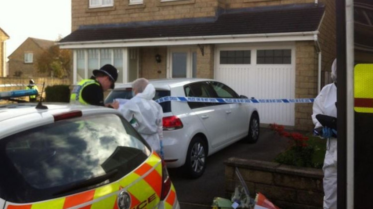 Forensic officers at the Lad's home in Clayton, Bradford